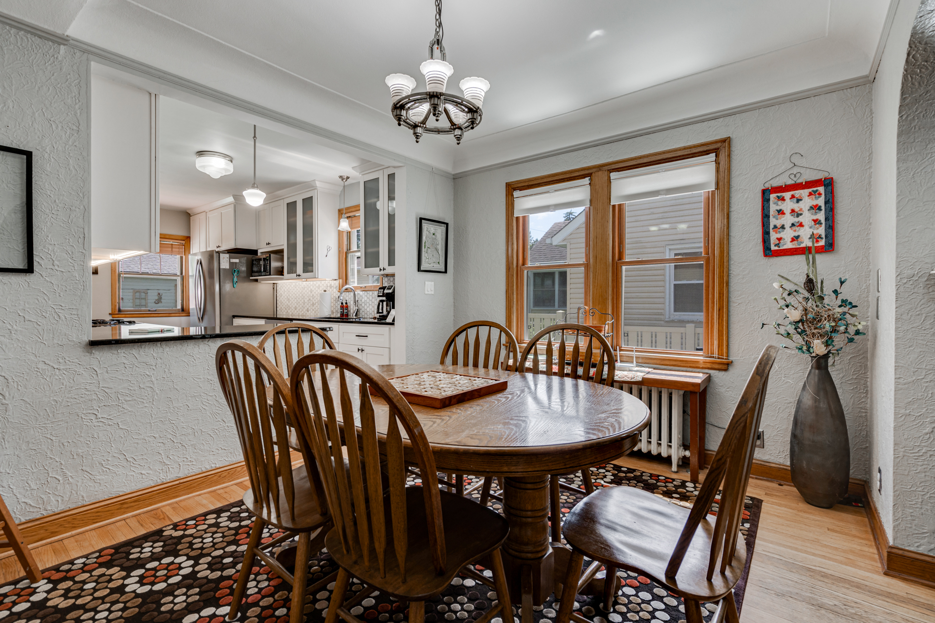 The dining room is right off the kitchen and comfortably seats six.