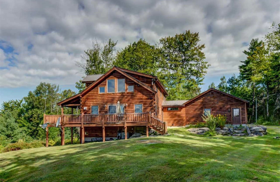 Perched on the hillside on 17 acres surrounded by serene and peaceful woods, this Coventry Log home is modern, classy and comfortable at once.