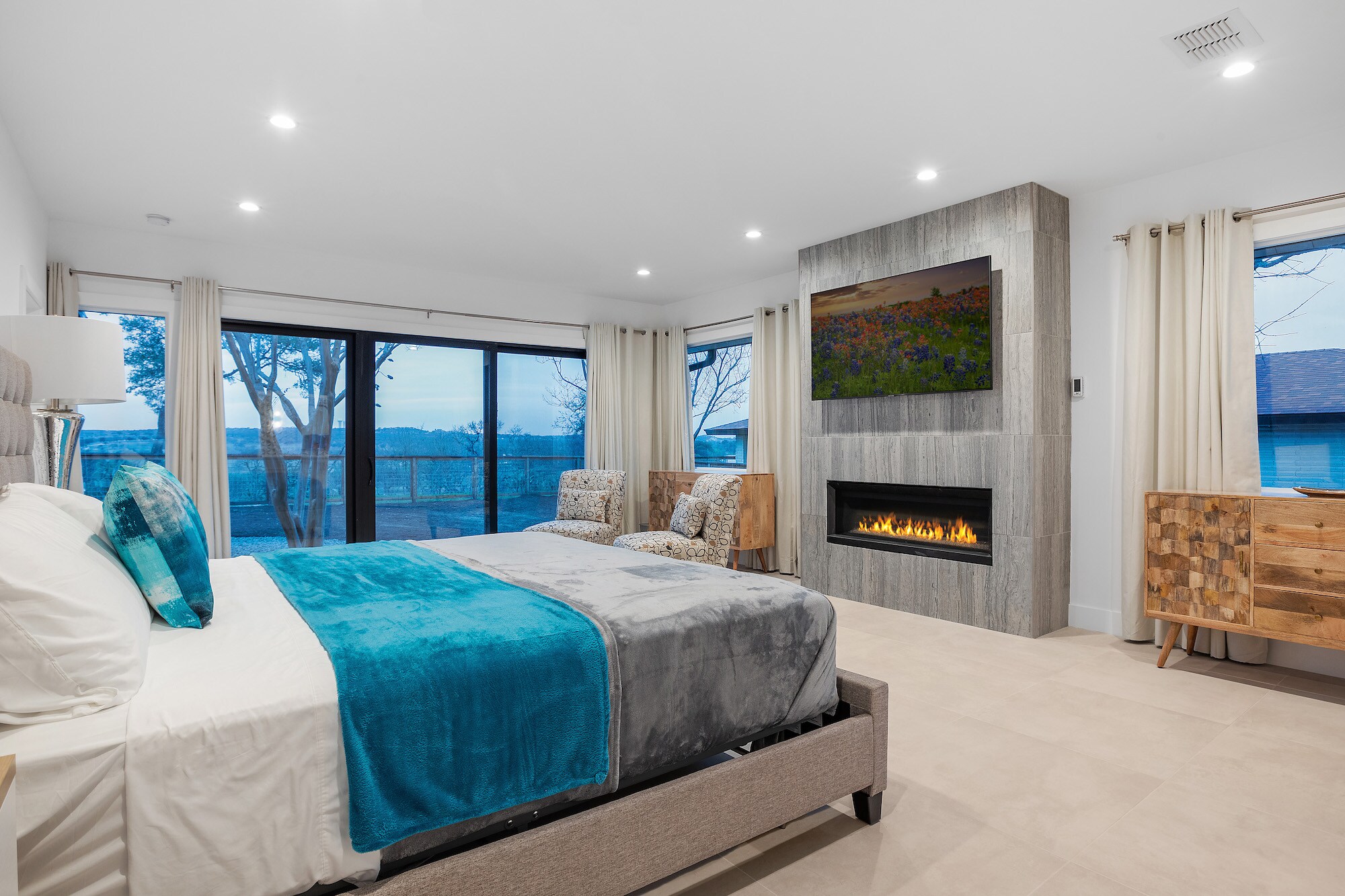 Master bedroom with access to back yard, gas fire place, and large flat screen TV