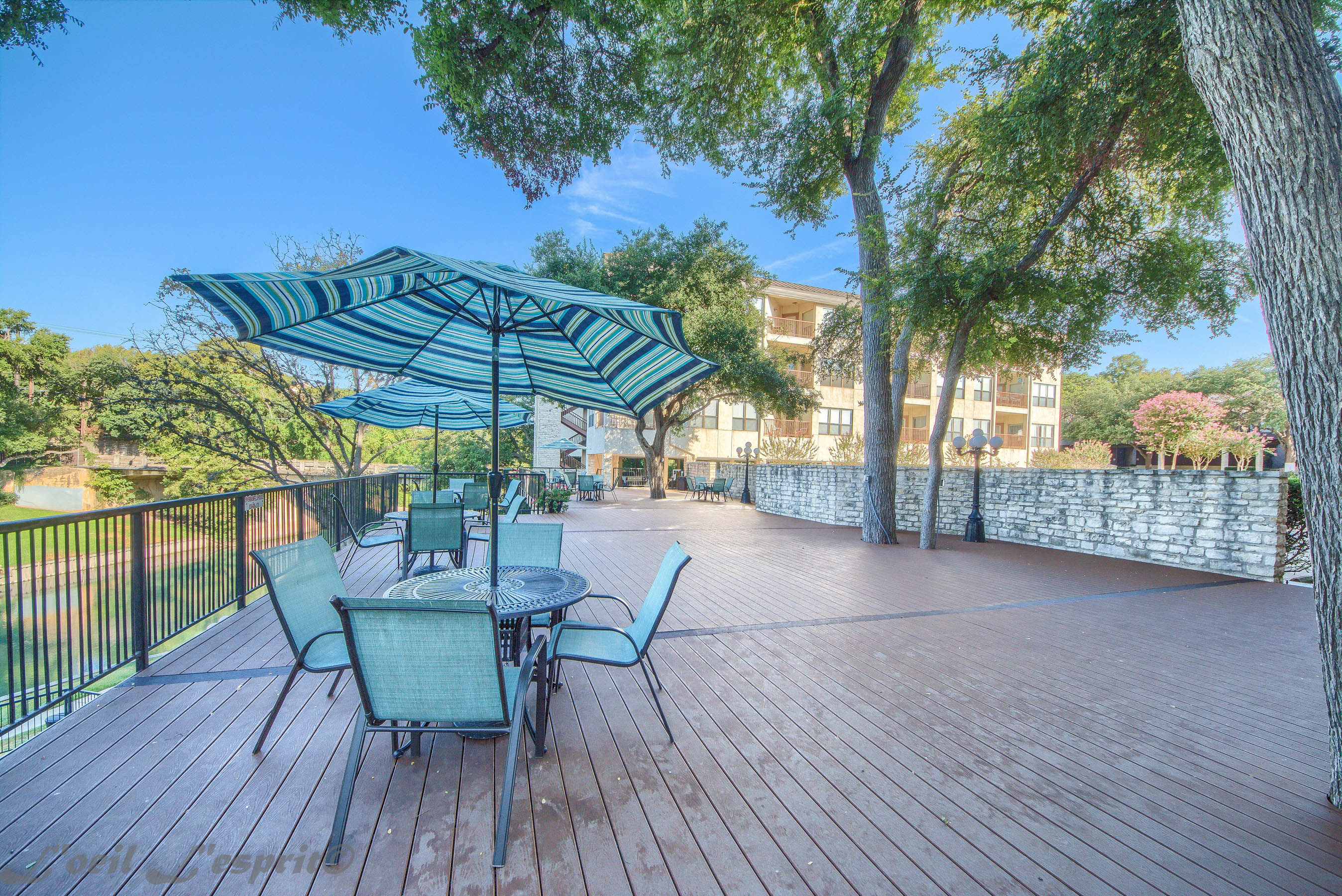 Large deck looking over the Comal river and swimming pool!