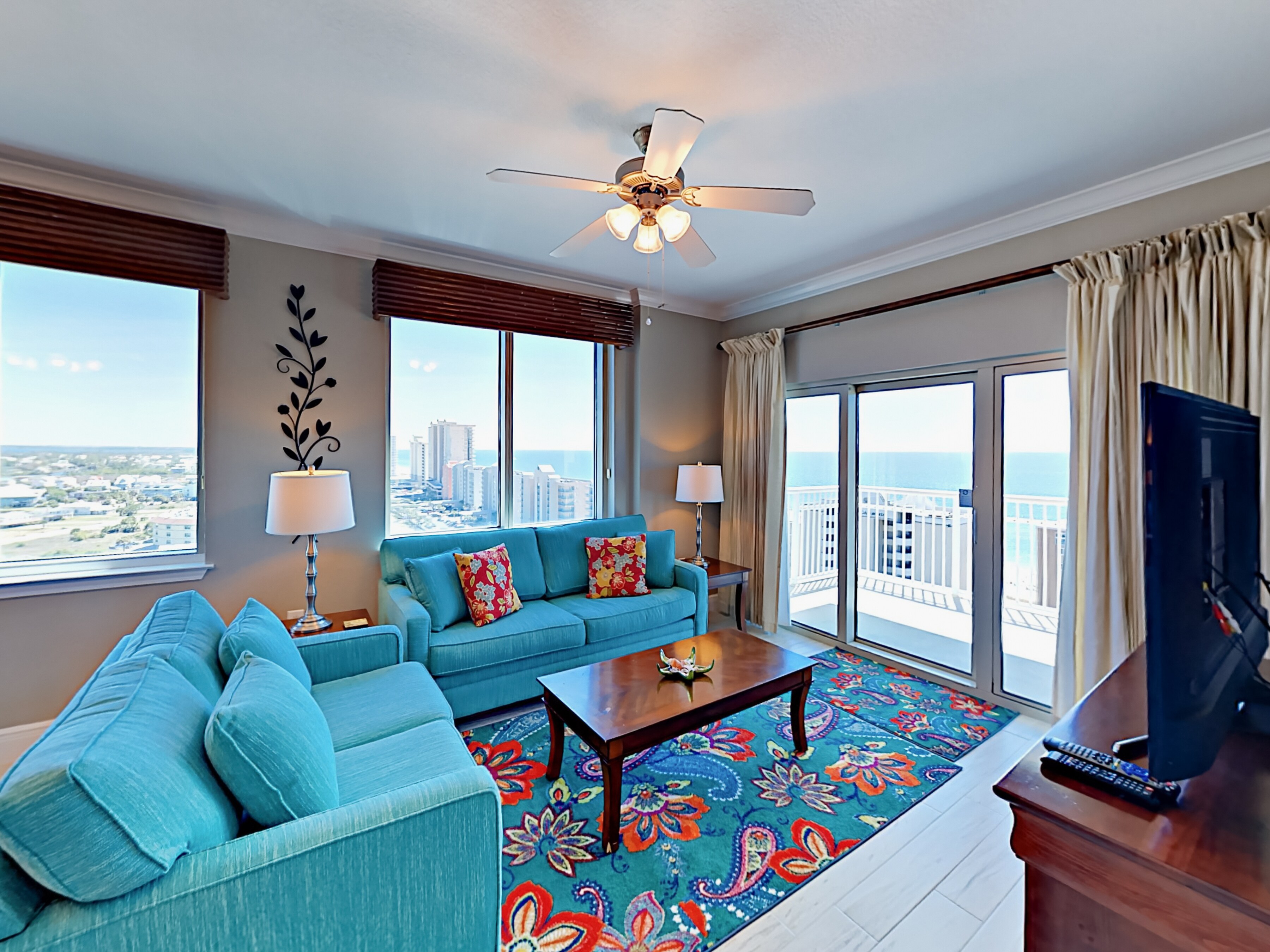 Welcome to Gulf Shores! This is a corner unit, meaning panoramic views from 2 balconies. Inside, light wooden floors and high ceilings make the space airy and bright.