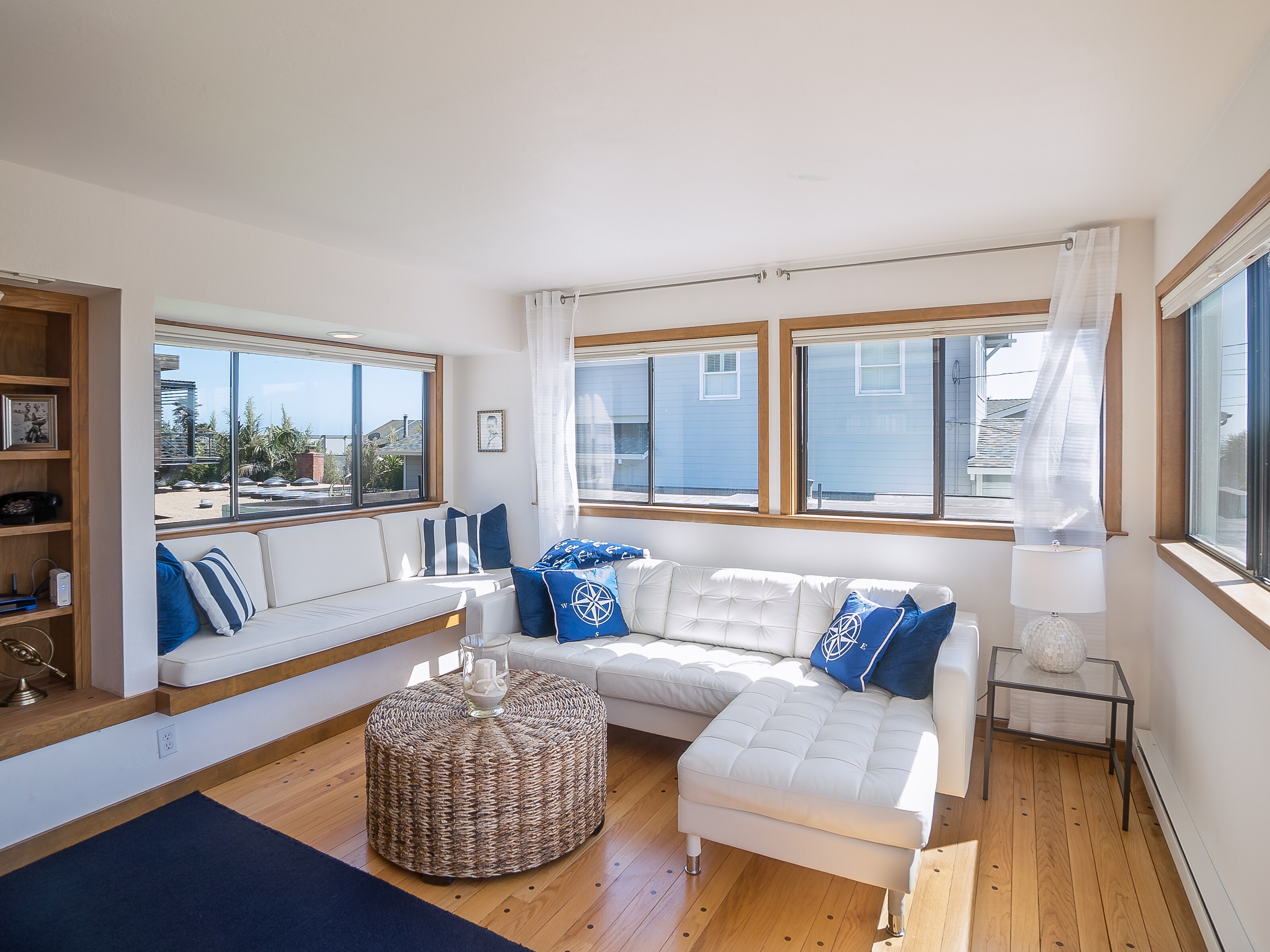 Welcome to Stinson Beach! The Malibu living room has a chic sofa and a cozy window nook.
