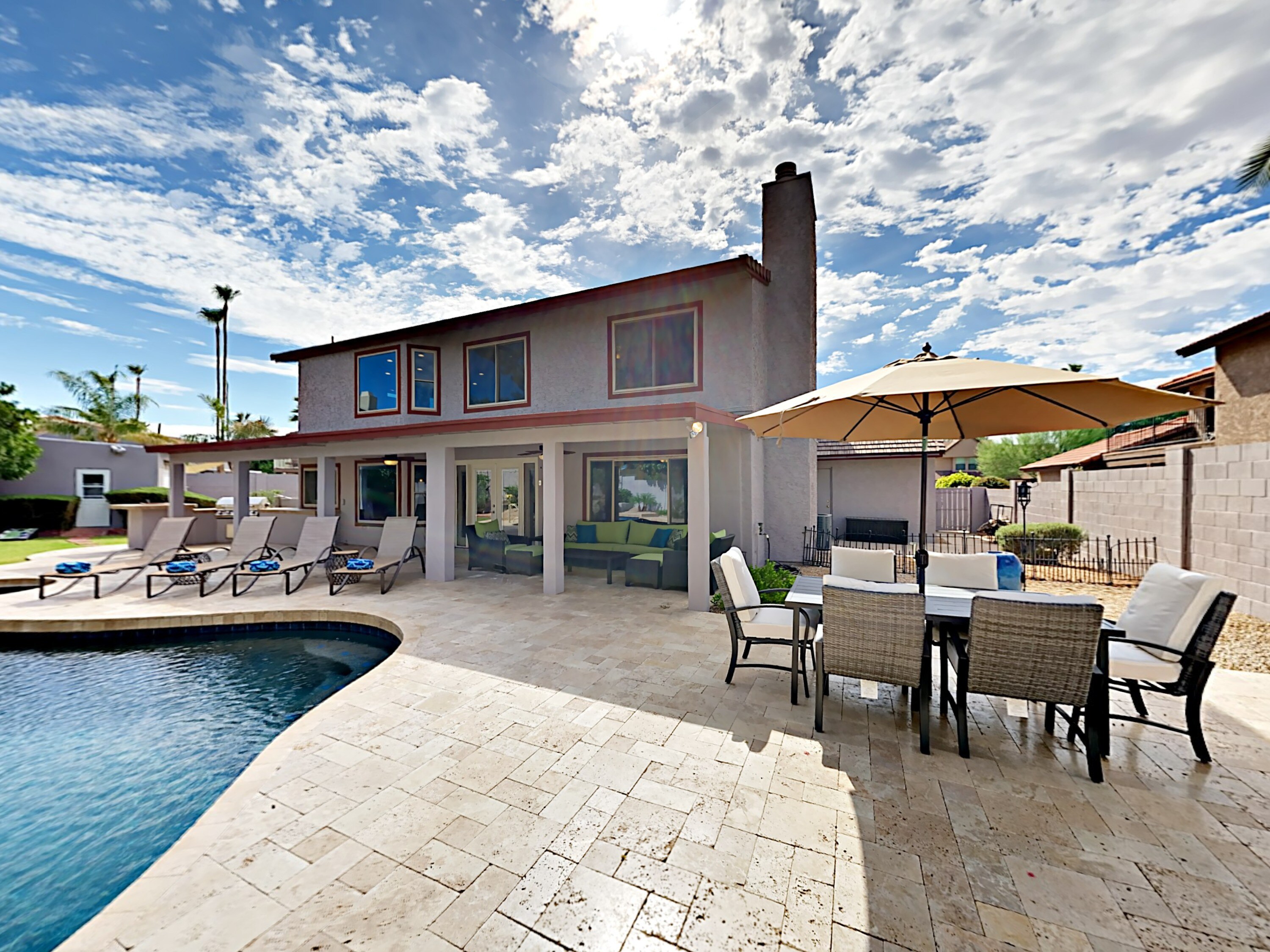 Spend sunny days in your backyard oasis on the pool deck.