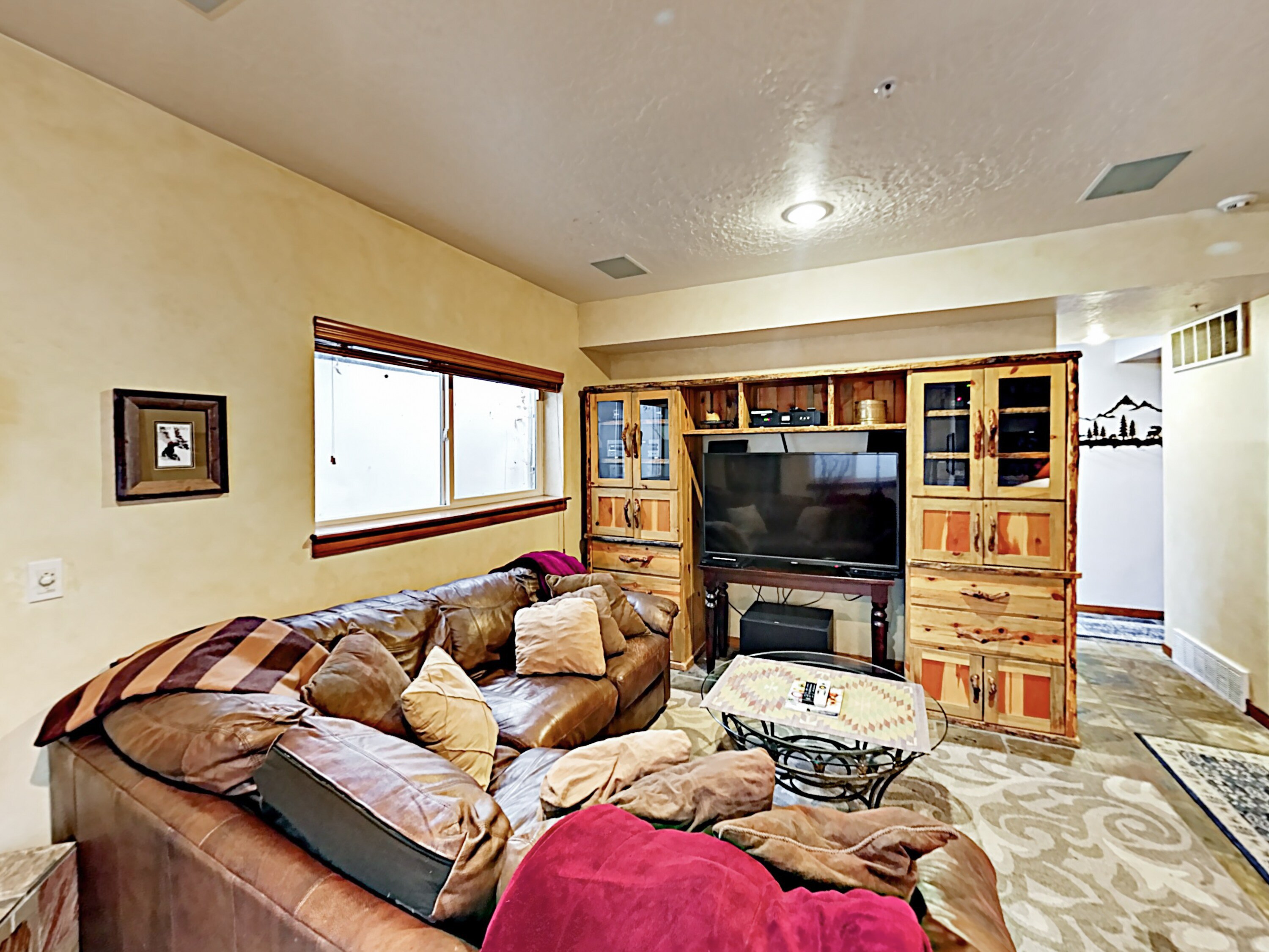 Enjoy movie nights in a 2nd living area with a comfy sectional and 55” TV with Blu-ray player.