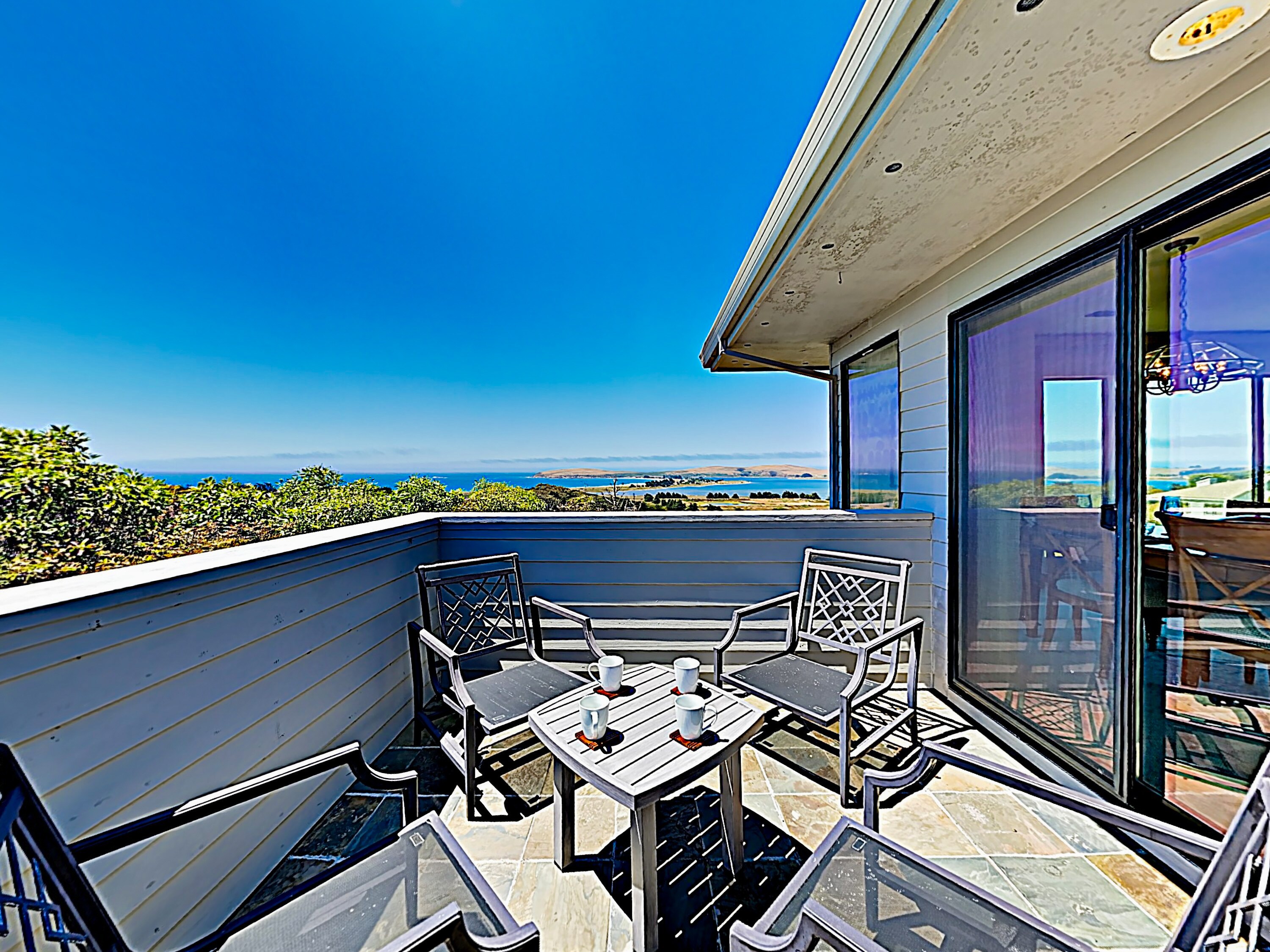 Ocean views and a refreshing breeze await on the balcony, where there’s seating for 4.
