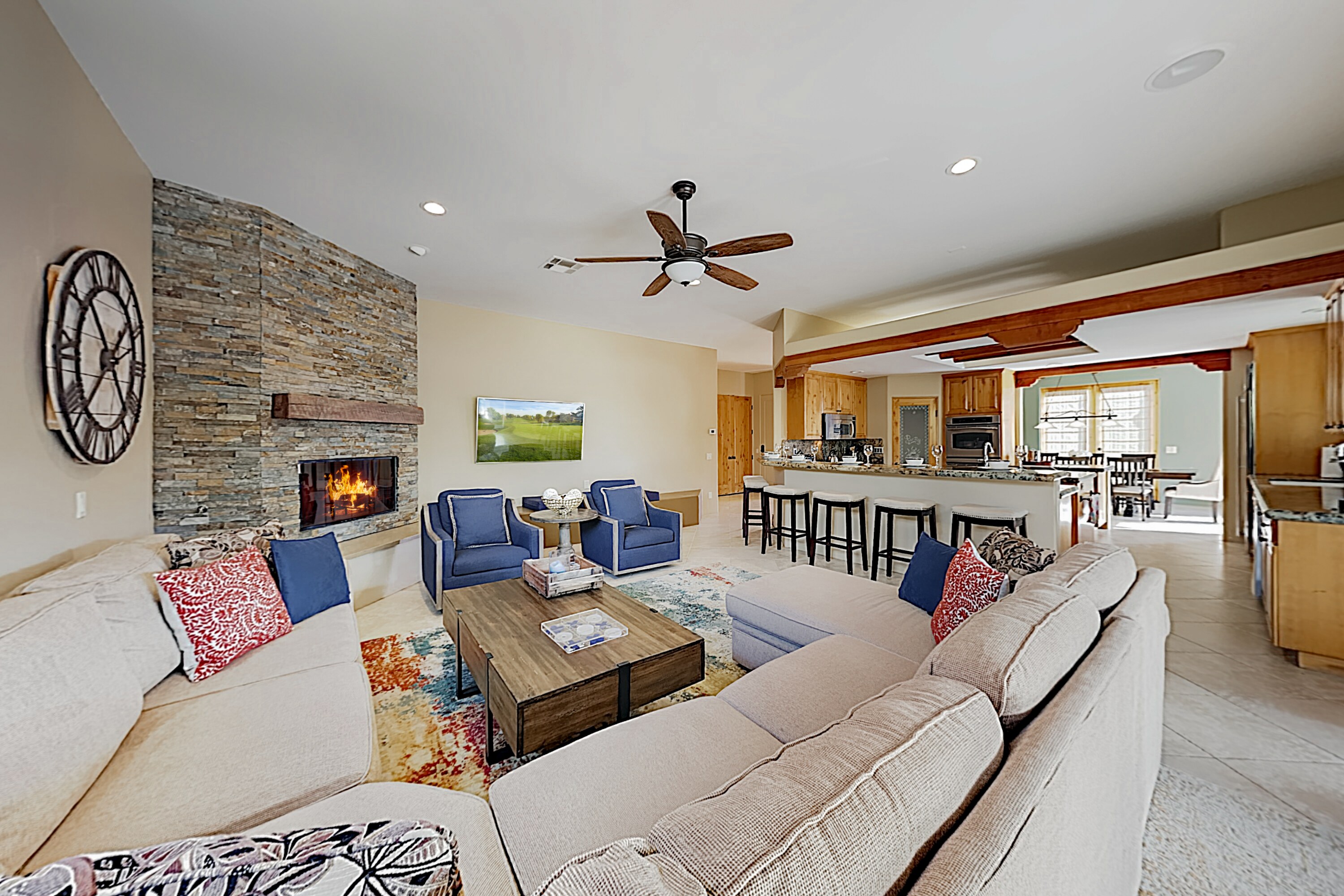 Unwind on the plush sectional and 2 armchairs in the living area.