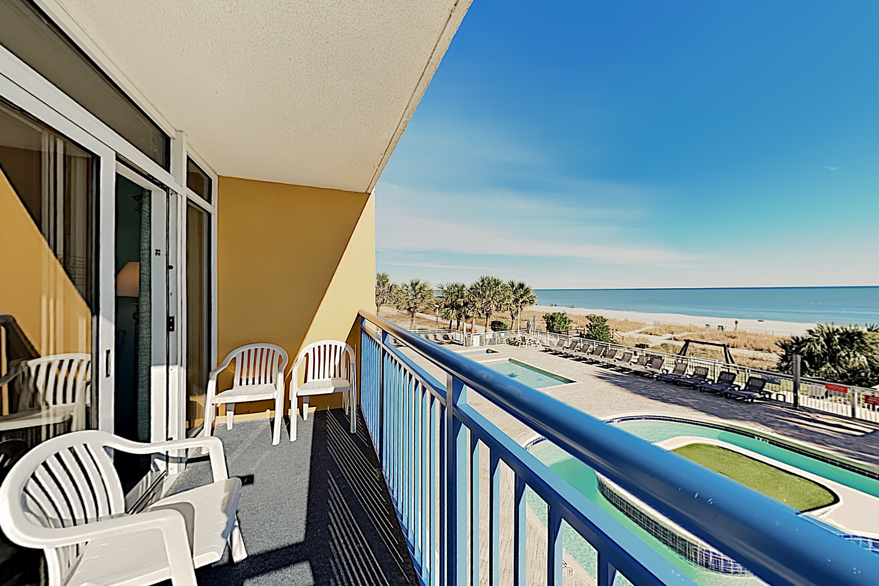Sip morning coffee on the beachfront balcony, outfitted with seating for 4.