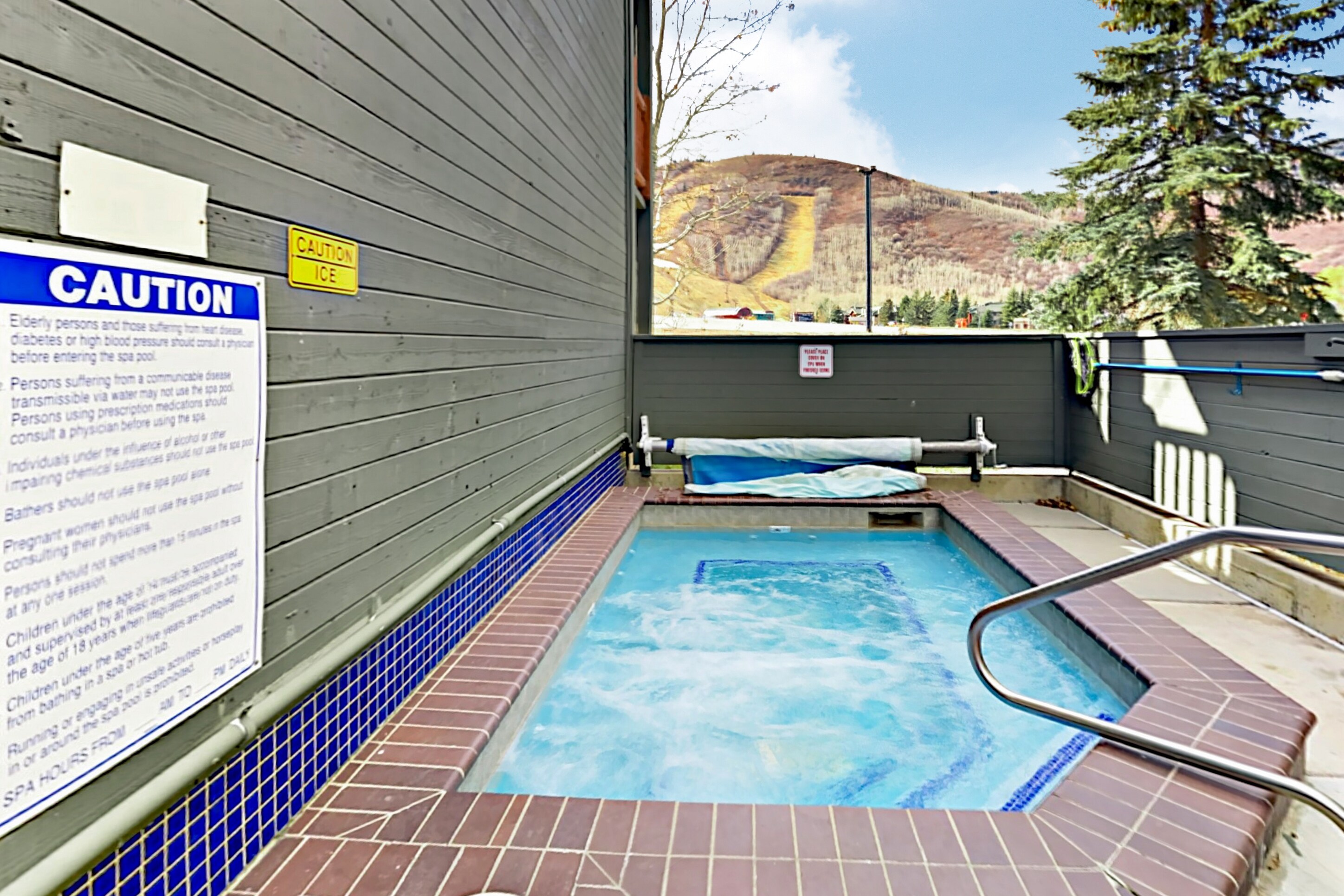 Relax in the bubbling hot tub with mountain views.