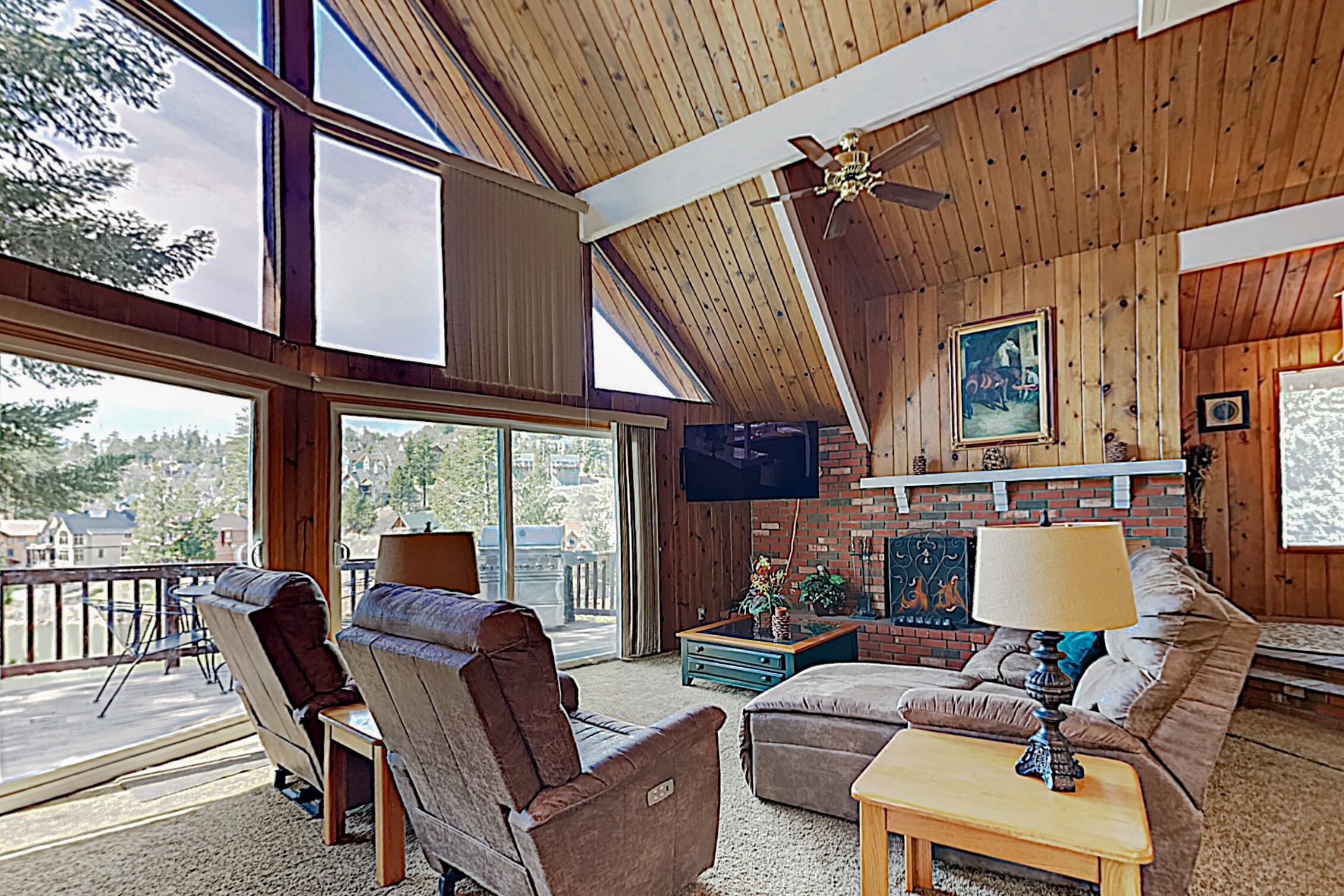 Unwind into vacation mode in the spacious living area, featuring soaring vaulted ceilings.