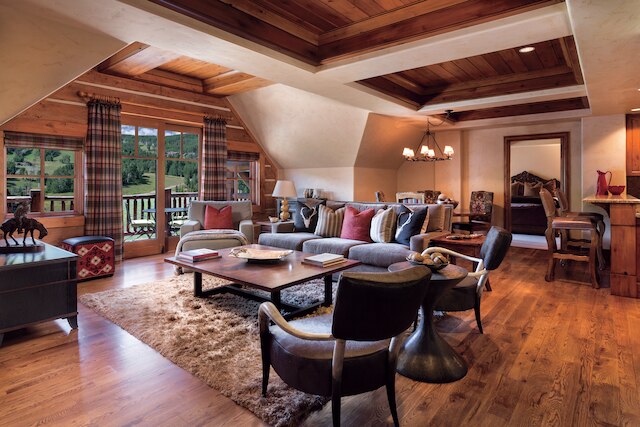 Large living room with contemporary wood ceilings