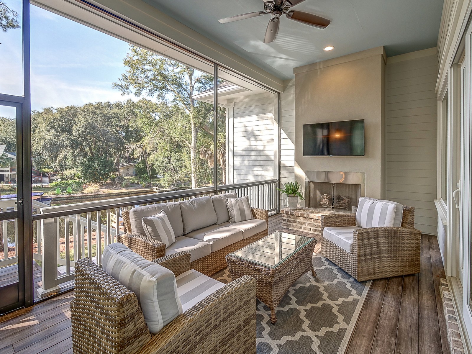 Off Living Room and Dining Area is a Beautiful Screened Porch Overlooking Pool and Lagoon at 24 Rum Row