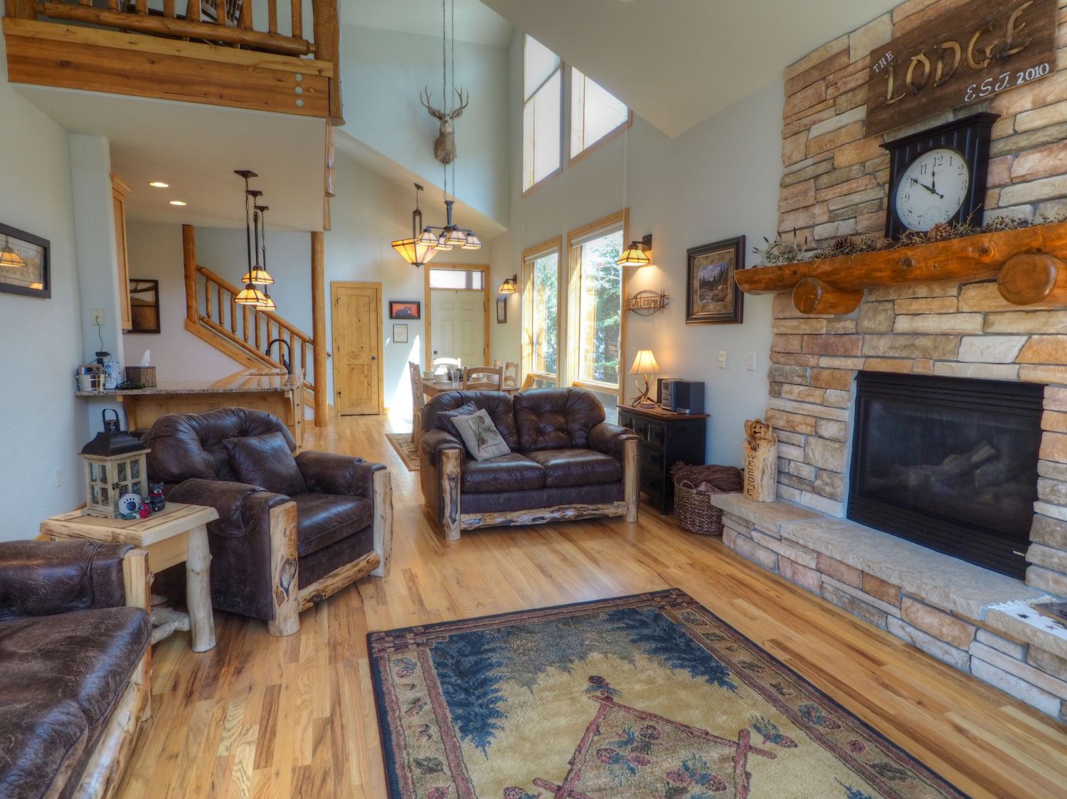 Rambling River Condo - Open concept mountain lodge living, dining and kitchen with soaring cathedral ceiling
