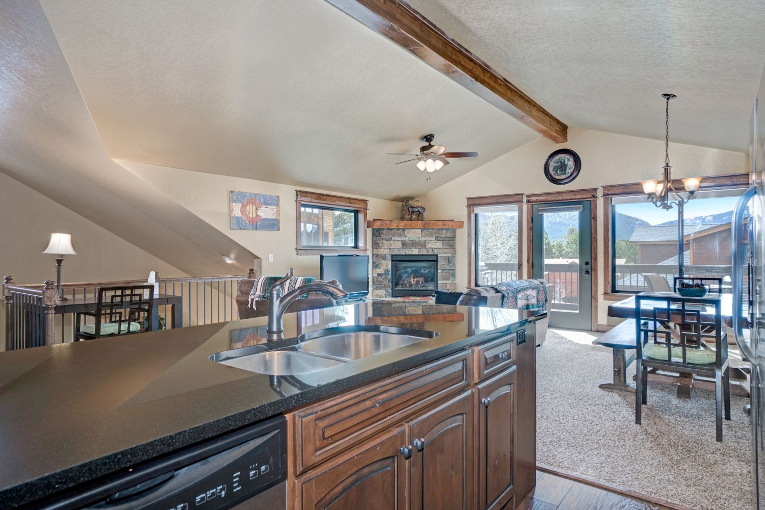Timber Mountain Retreat - Open concept kitchen/dining area. Dining table just across from the kitchen/counter-top seating. Sliding glass doors out to deck provide beautiful mountain views.