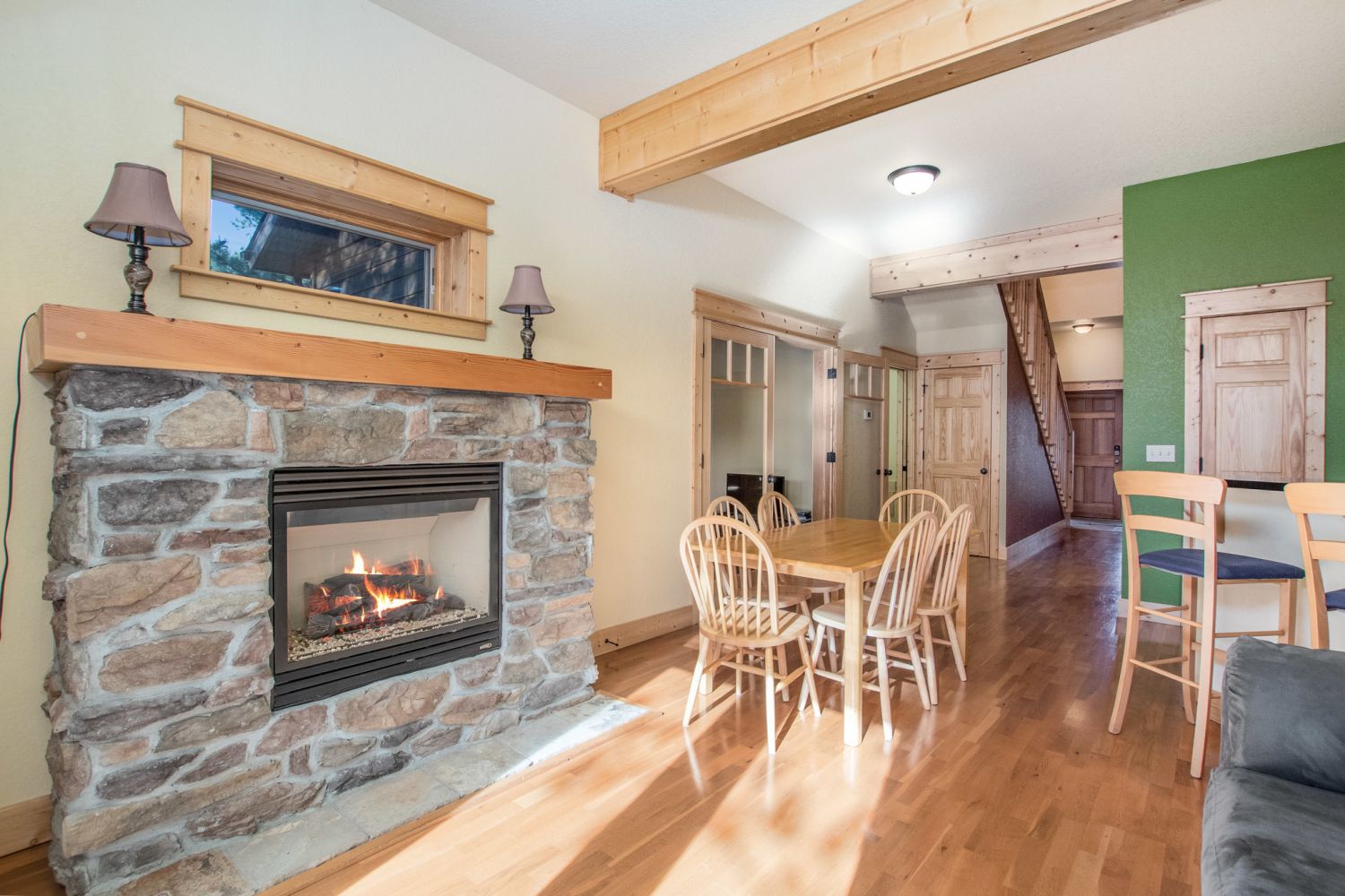 Columbine Meadow - Stone gas fireplace warms the open concept living area.