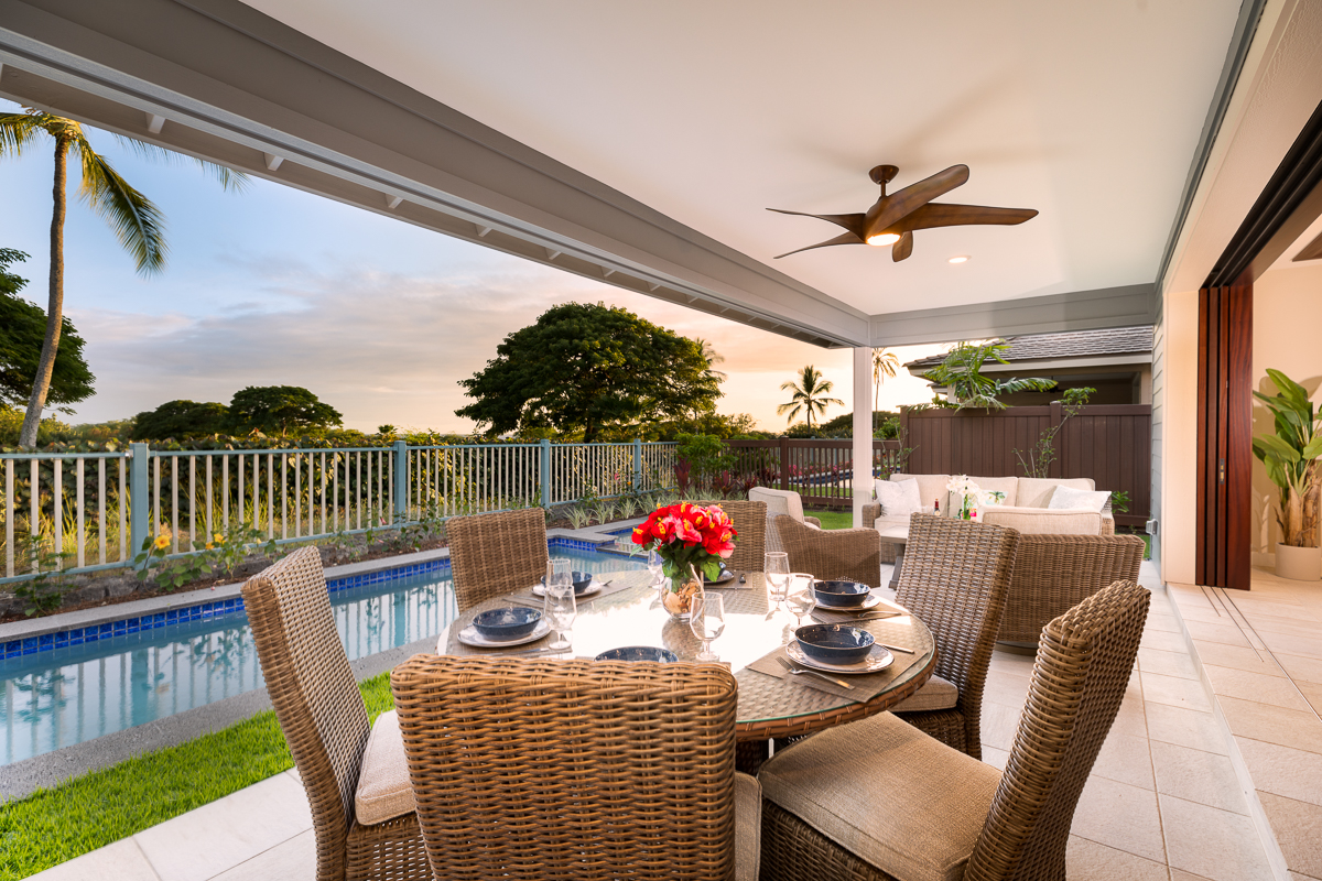 Enjoy open-air meals poolside on the covered lanai