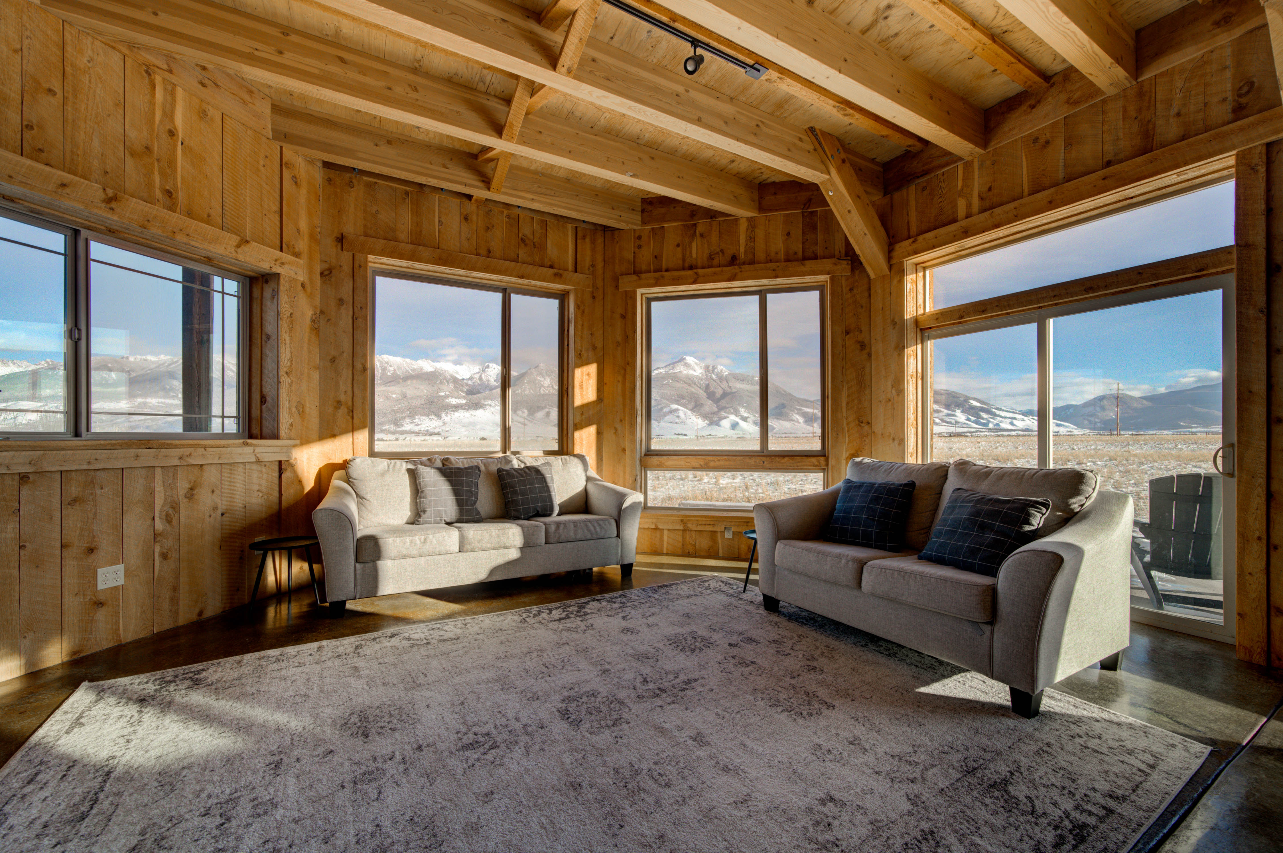 The living room offers stunning views of the valley