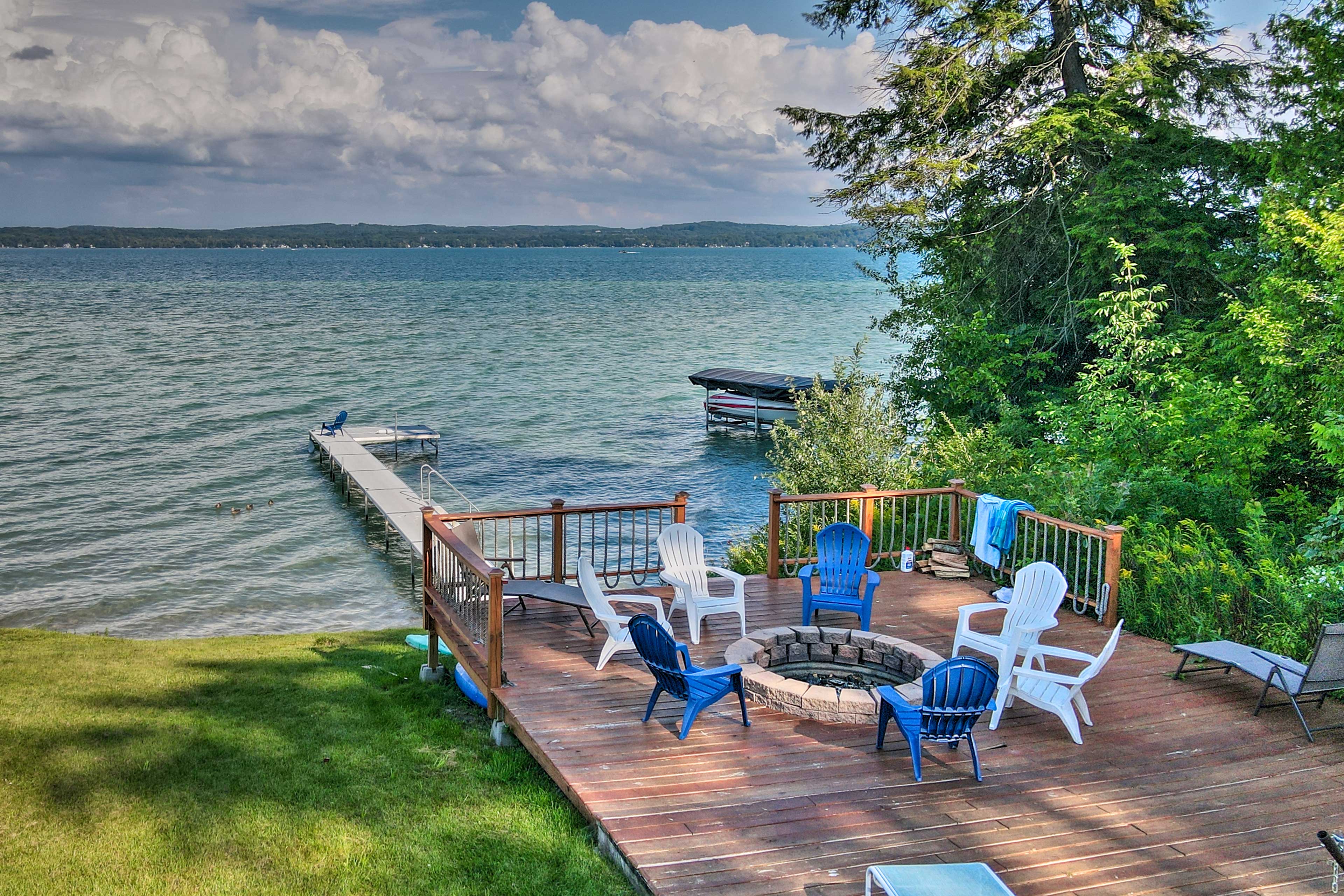 Property Image 1 - Torch Lake Home w/ 116 feet of Blue Water Access!