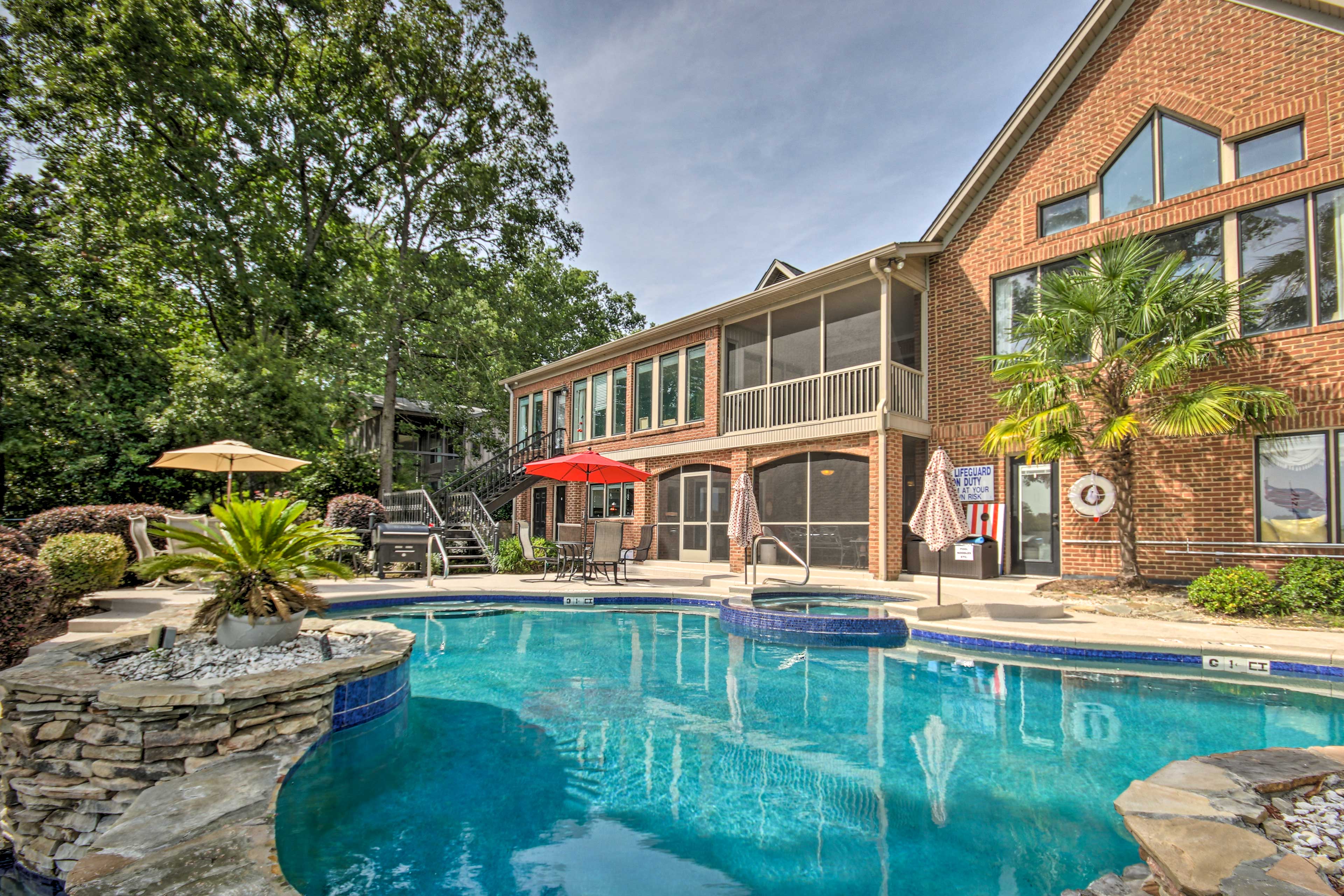Property Image 1 - Luxe Lakefront Apartment w/ Shared Pool & Dock!
