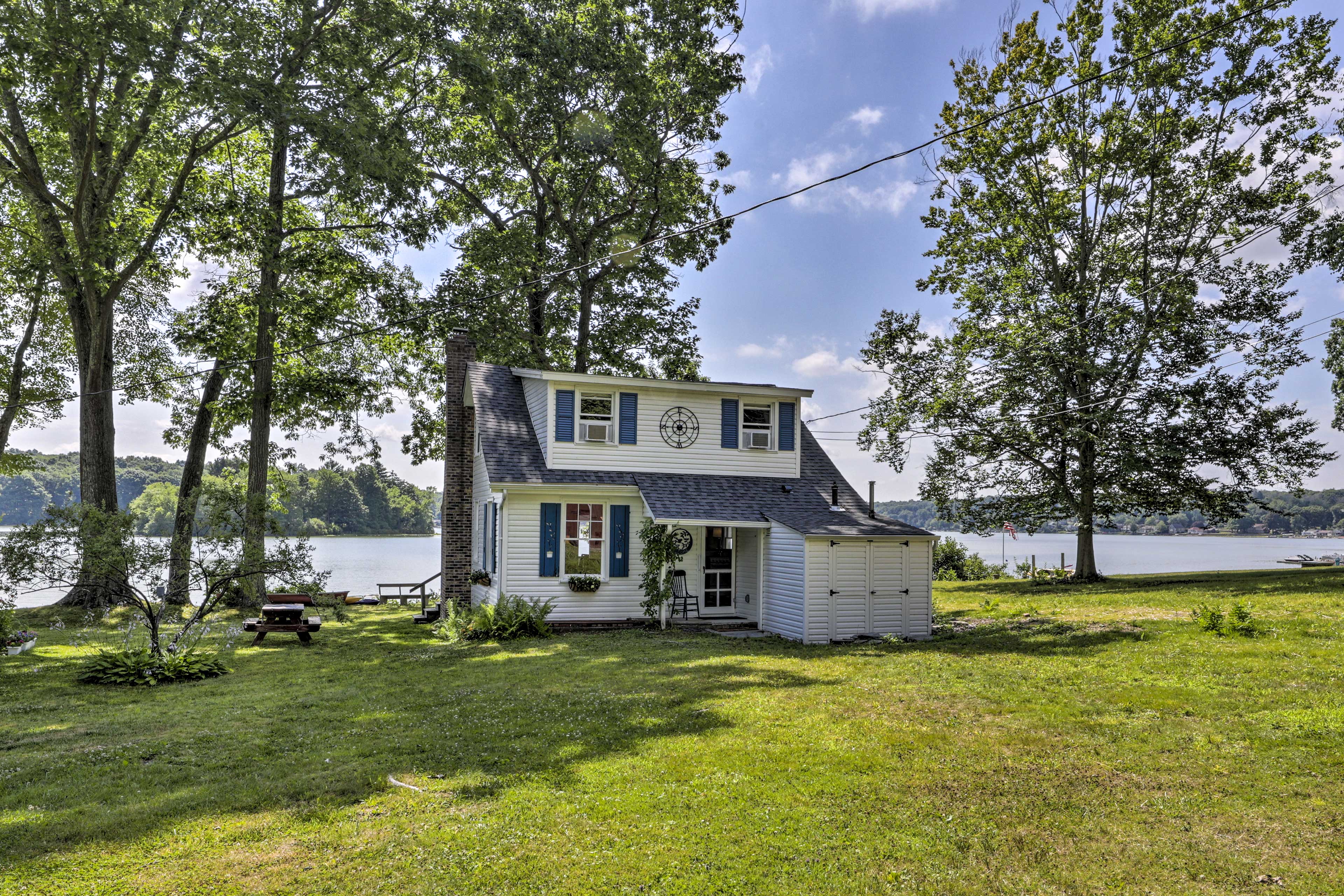 Property Image 1 - Lakefront Cottage w/ Covered Porch & Dock!