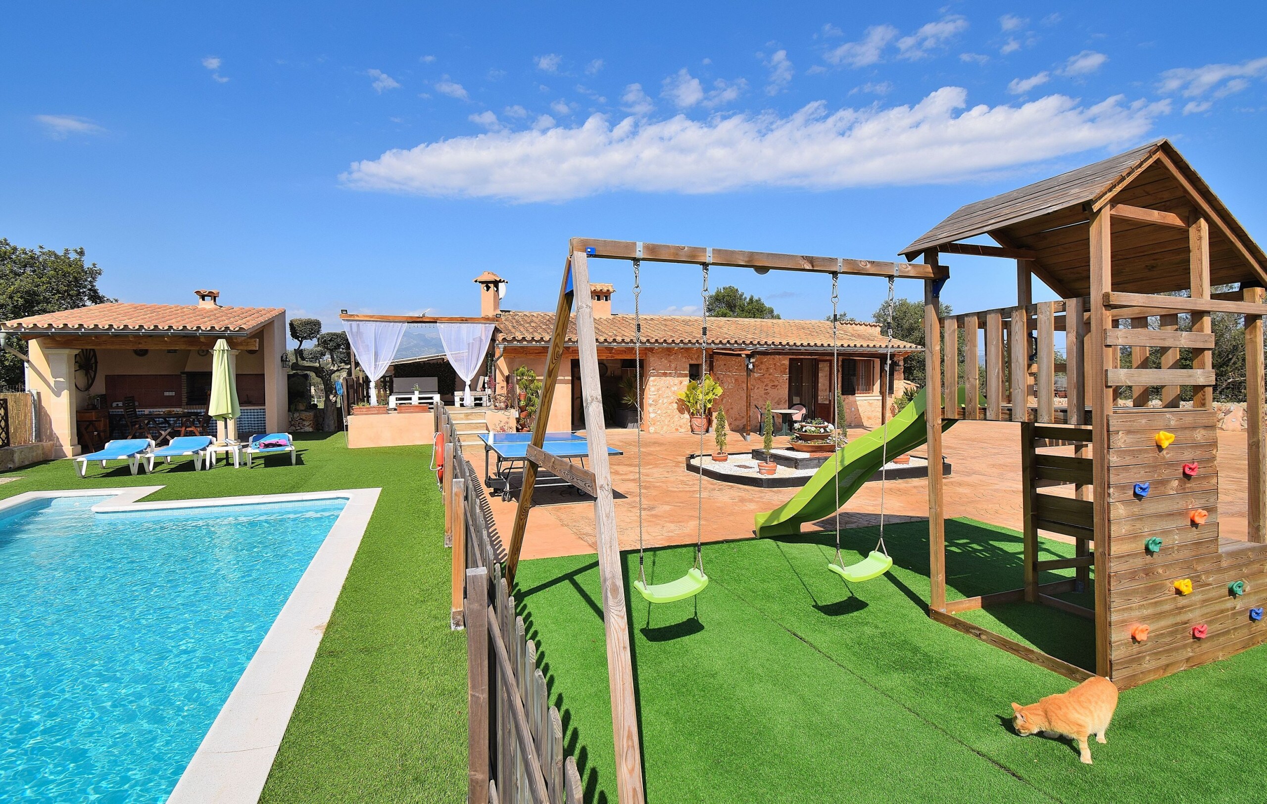 house with swimming pool and playground for children
