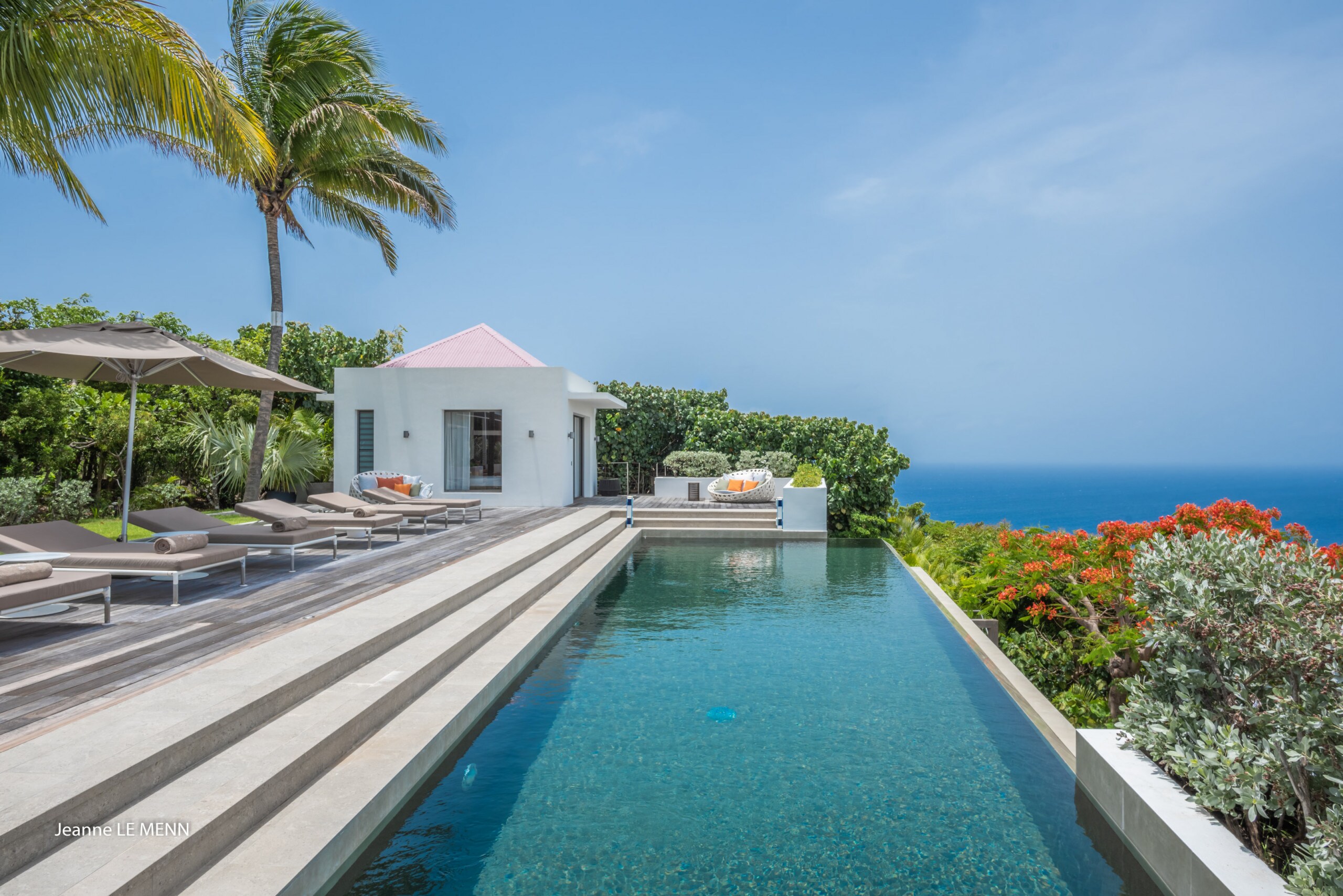 Heated pool with beautiful ocean views, expansive terrace with loungers and deckchairs.&nbsp;