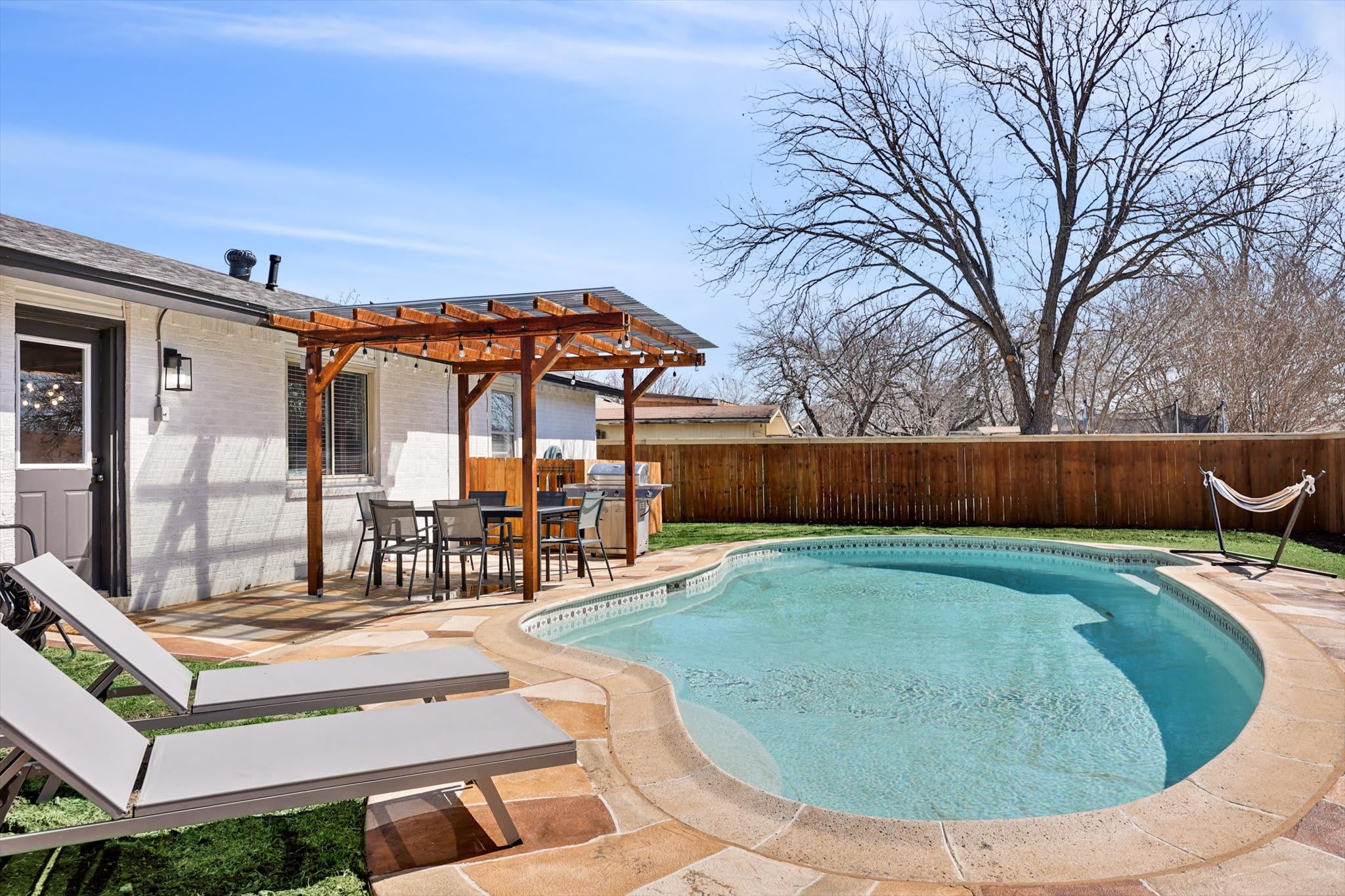 Step into this private backyard oasis and feel the stress of your daily life slip off your shoulders!
