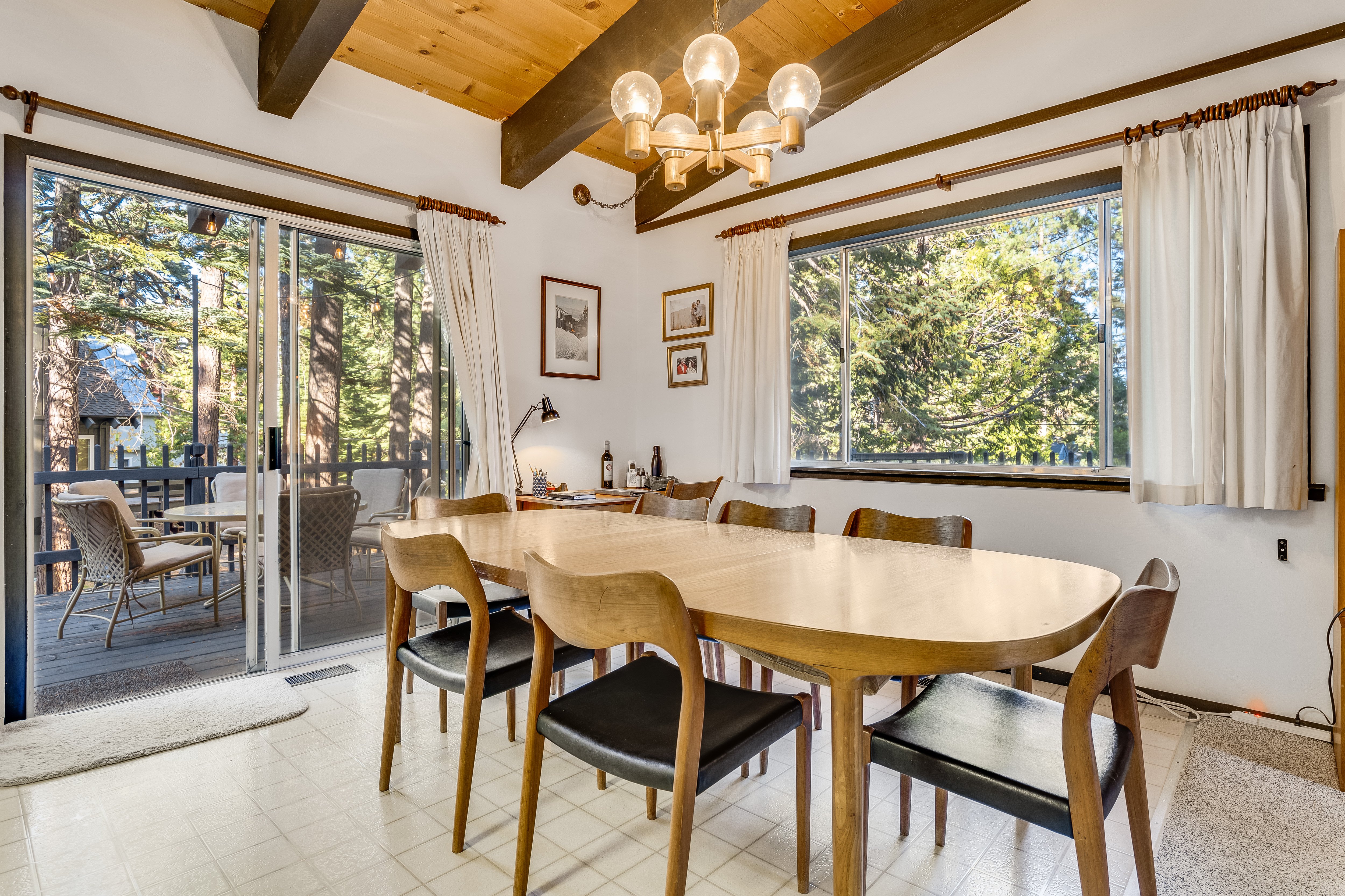 Bright dining area with treetop views.