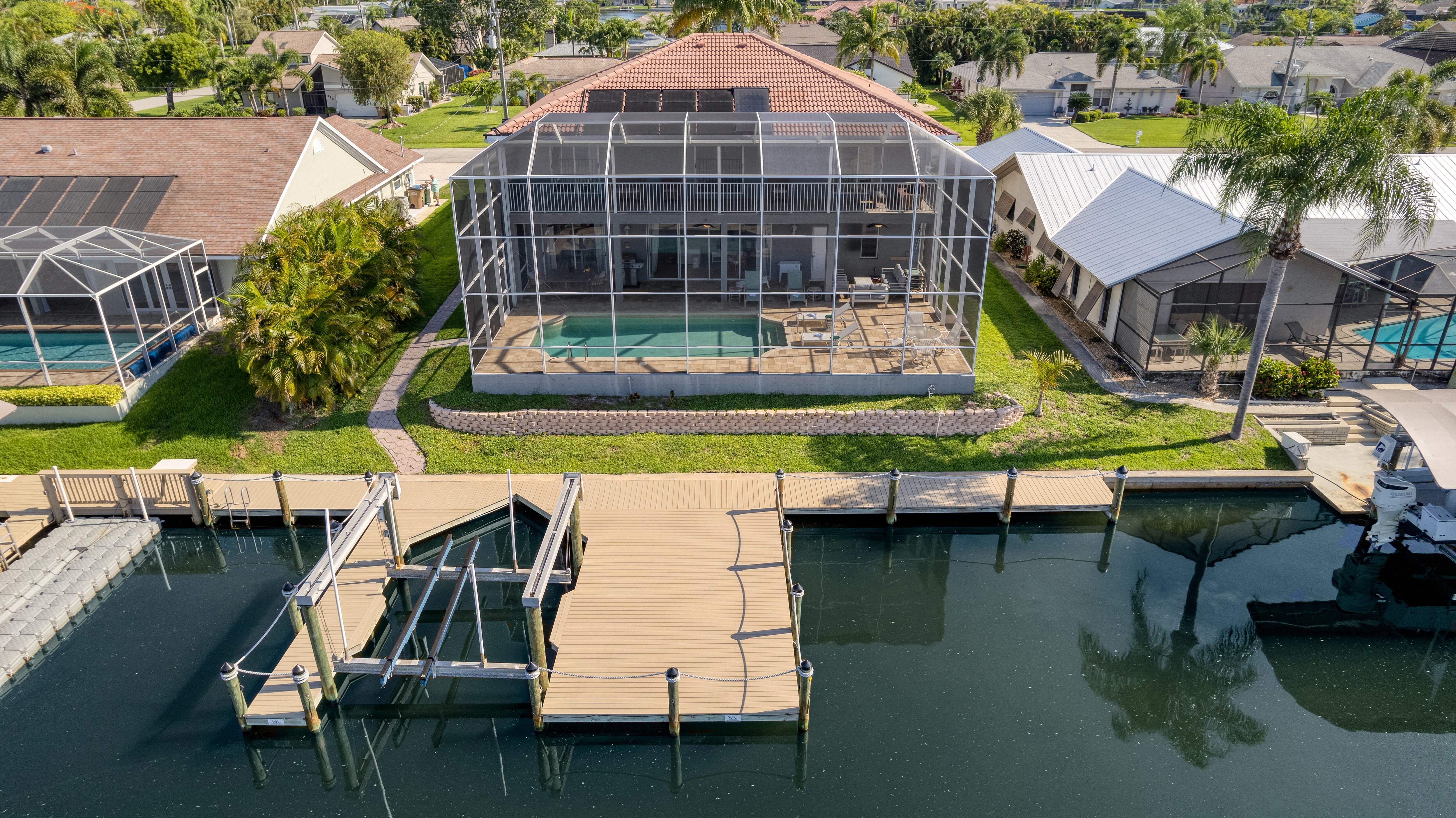 A beautiful estate with a screen-enclosed private pool and dock.