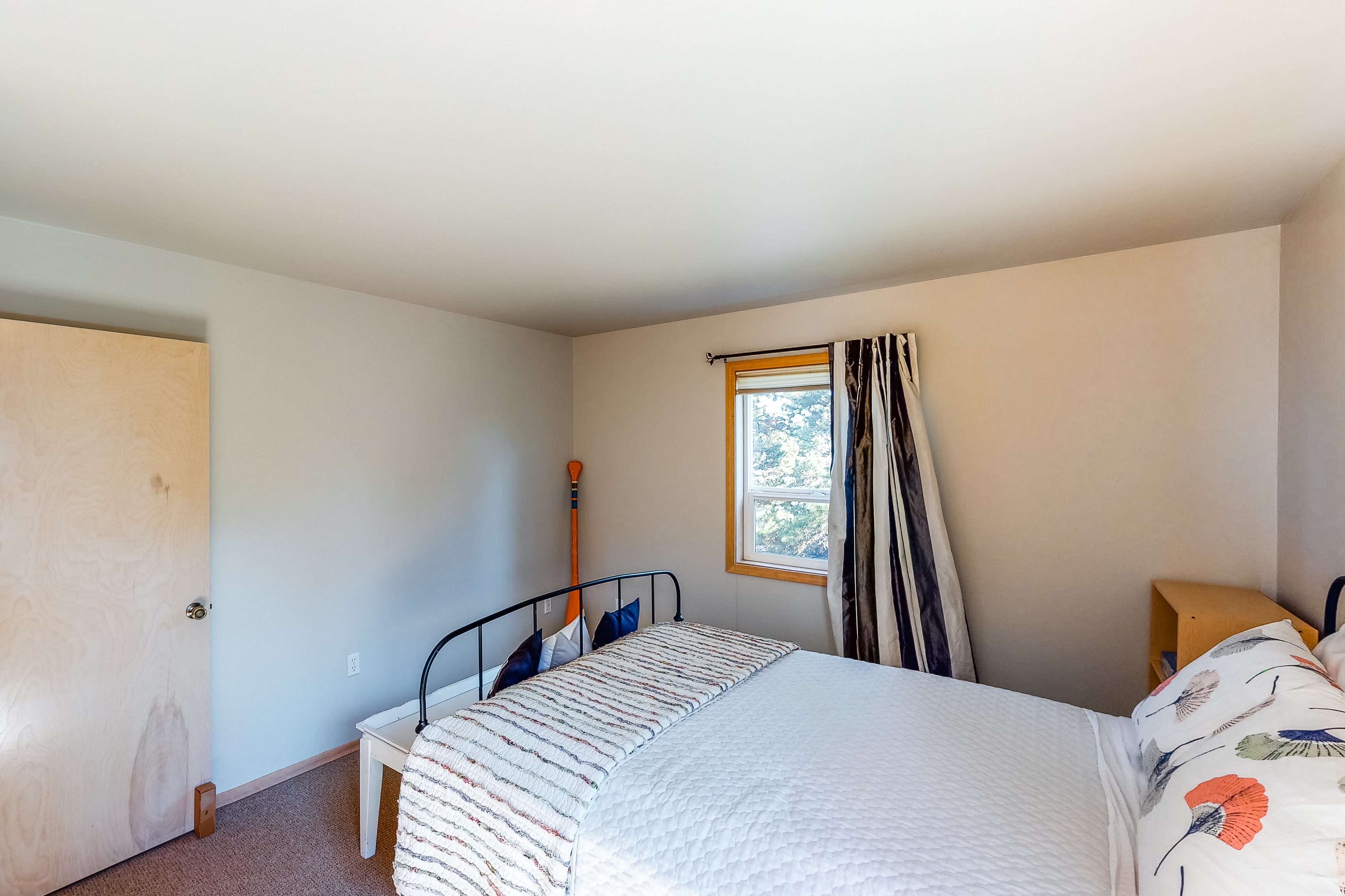 Bright dog-friendly home with wrap-around deck just steps from beach