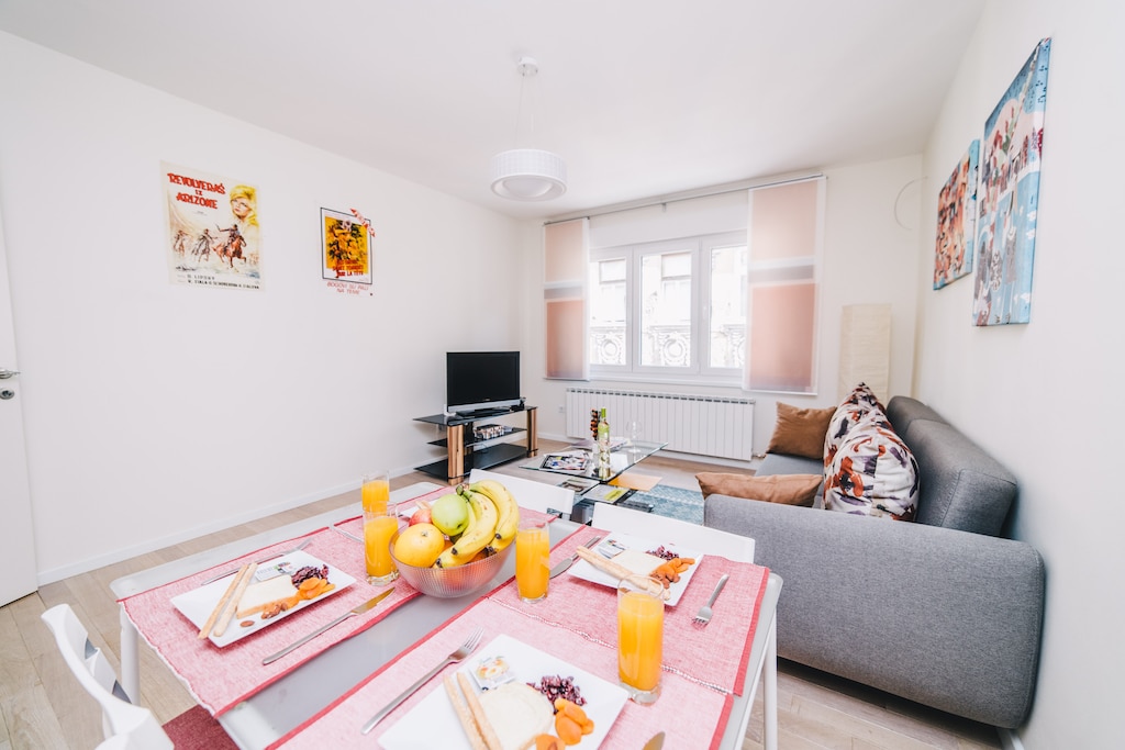 Bright and colorful living room with a dining area