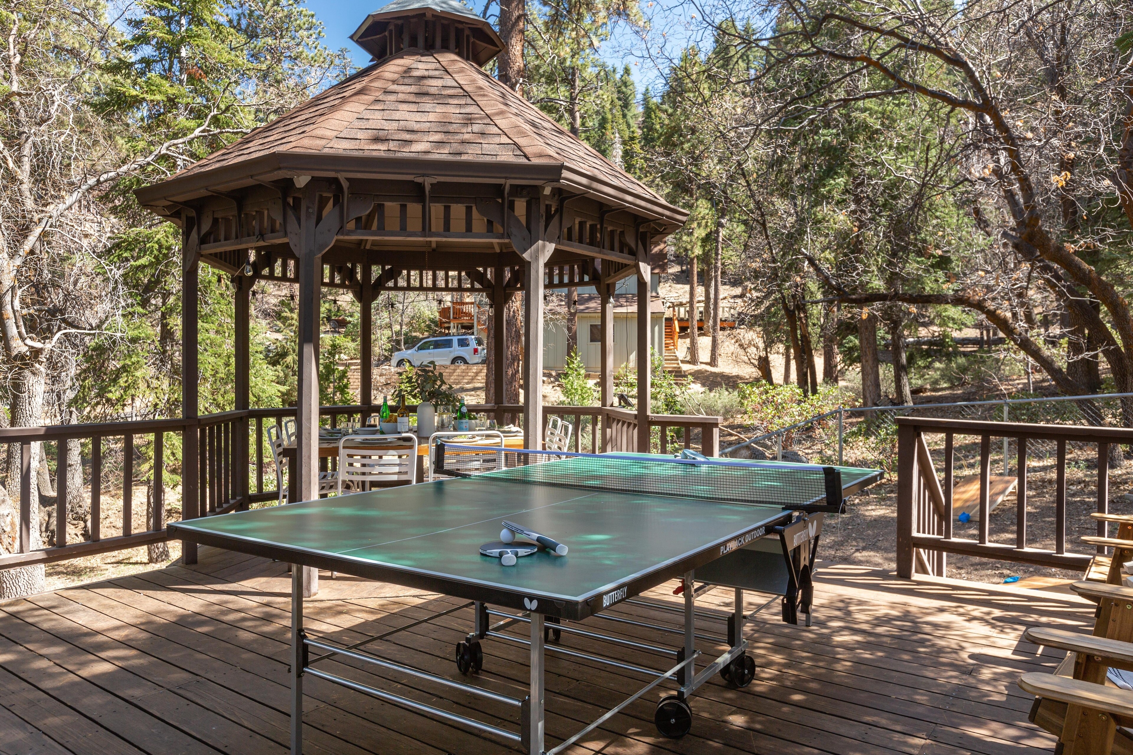 Your spacious deck comes equipped with a gazebo, ping pong table, and lounge chairs.