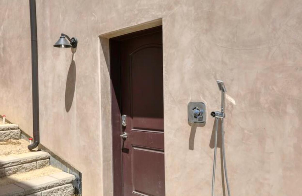 Both sides of the twin home feature an outdoor shower, allowing you to rinse off that sandy beach vibe before entering the house.