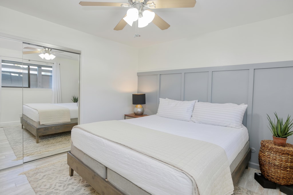 Cal-King bed with fluffy white linens