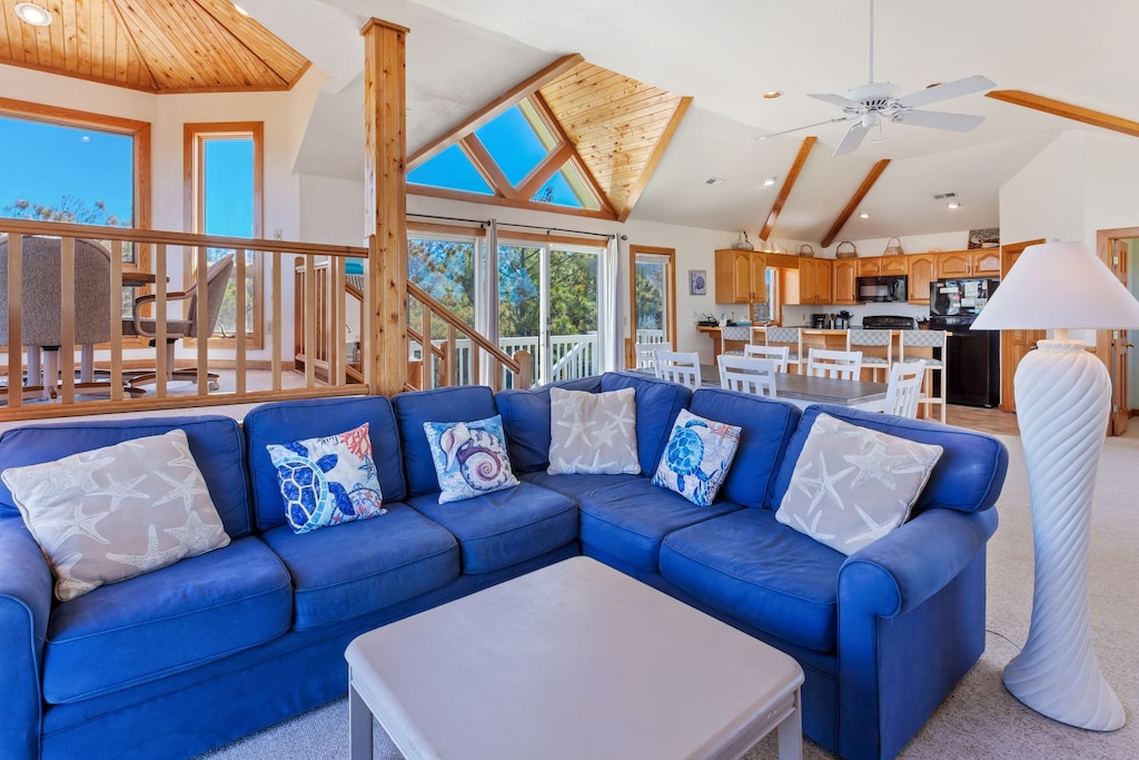 Relax in the spacious Living Area with high ceilings and plenty of natural light!