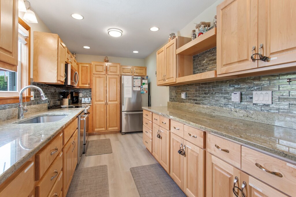 Whip up something delicious in the Kitchen with modern appliances and plenty of prep space.