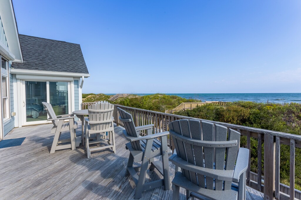 The Top-Level Back Deck with views of the ocean is the perfect spot to relax.