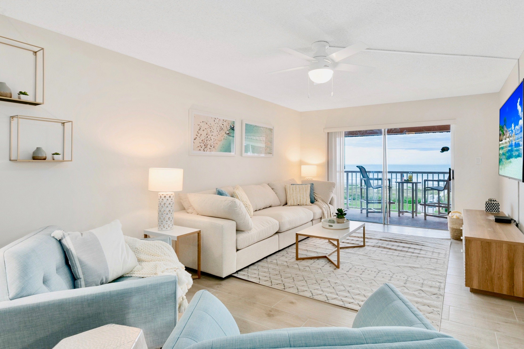 Bright and beachy living room with a view!