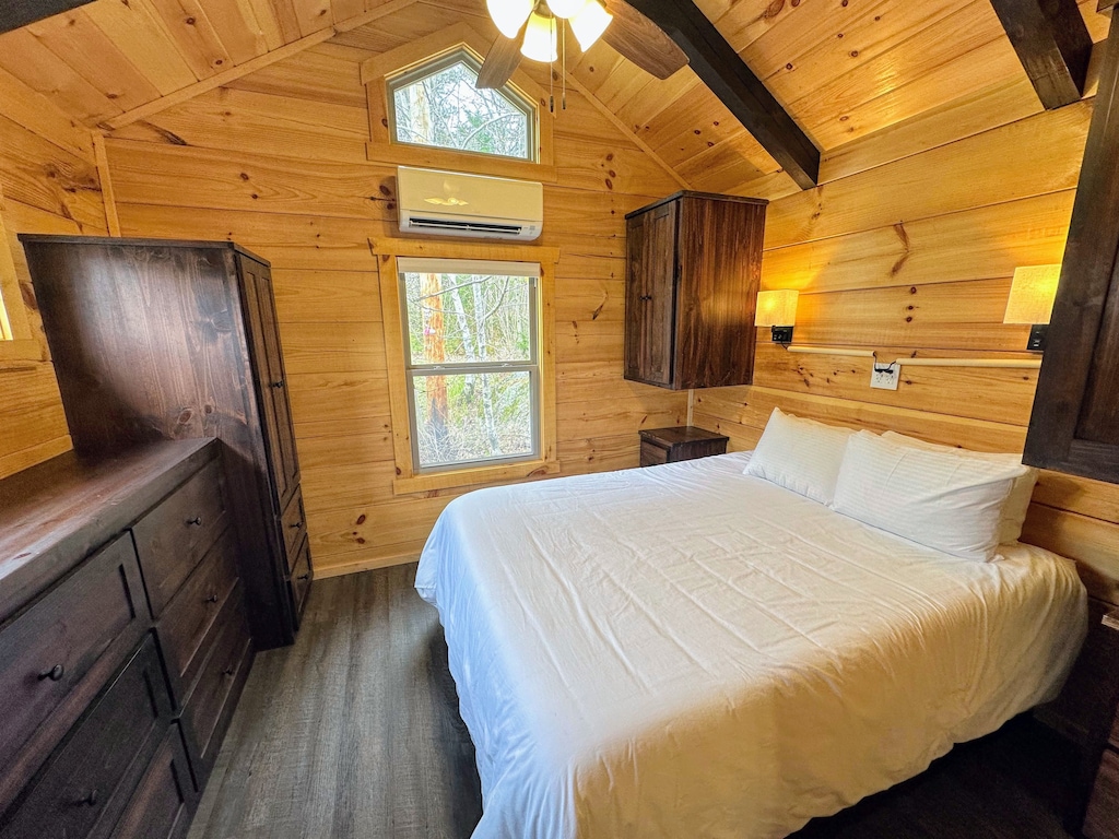 The main bedroom is past the kitchen and bathroom and has a queen bed.