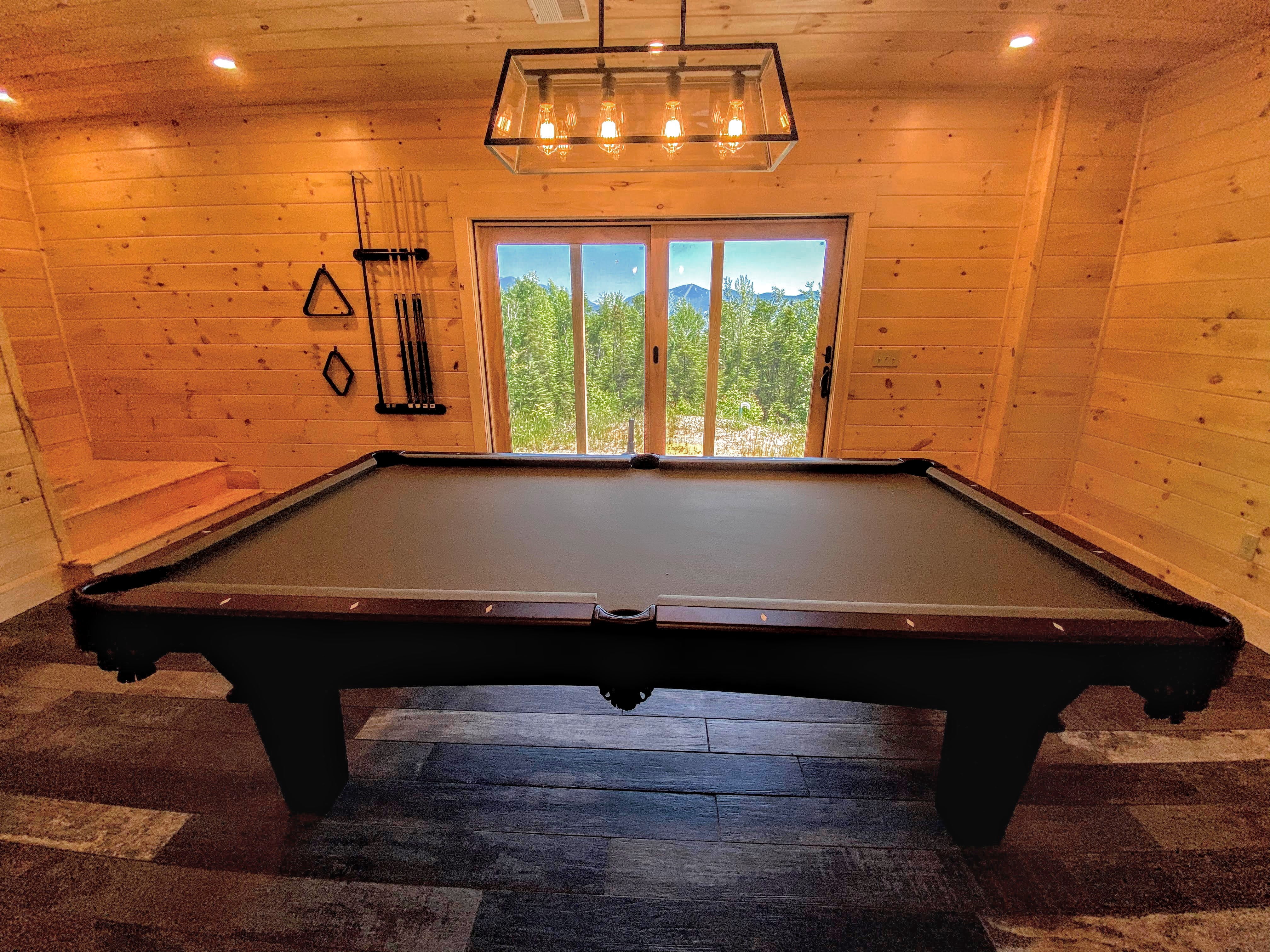 The pool table in the lower level area and access to the back yard!