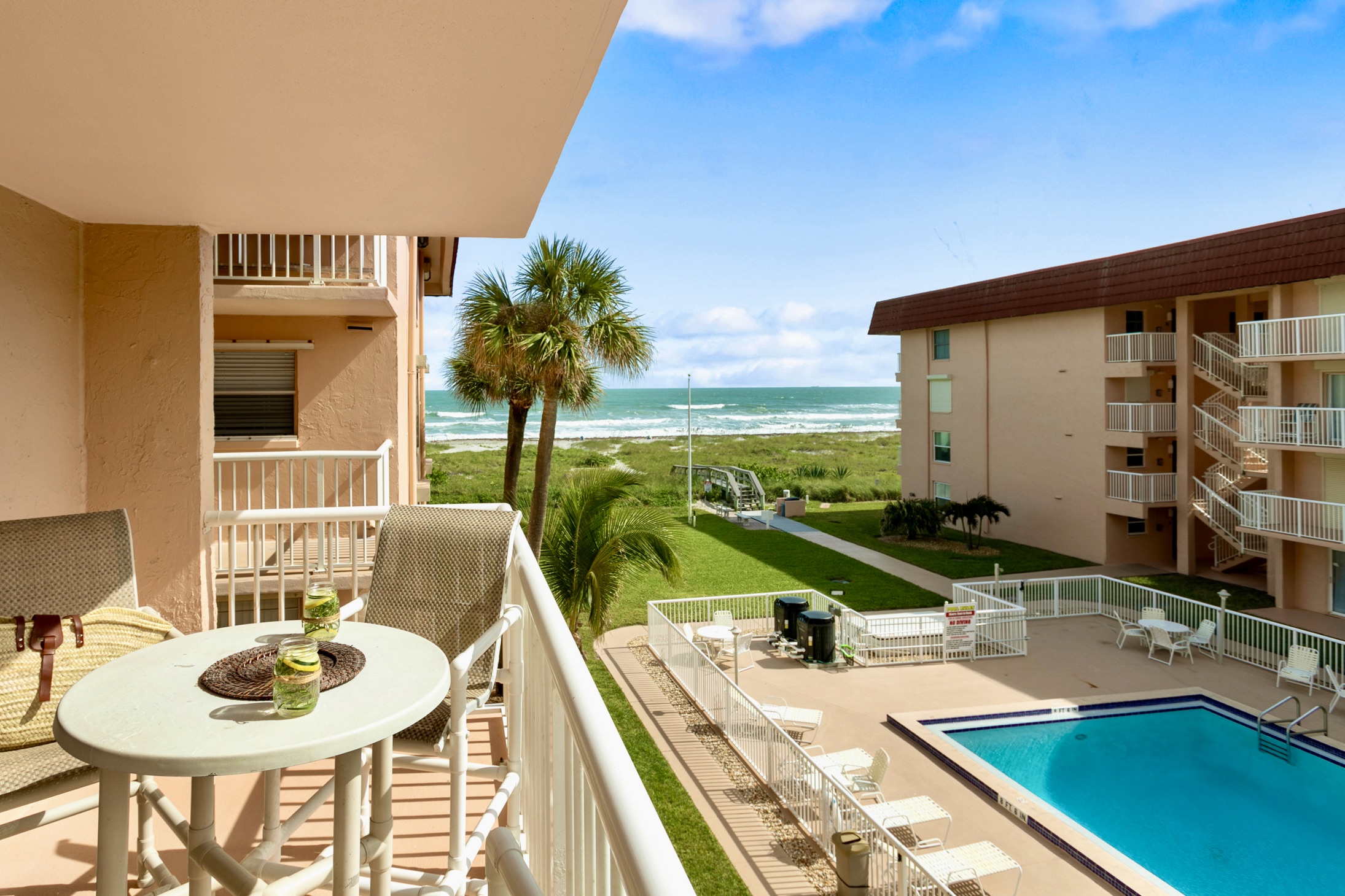 Enjoy your sun exposed balcony with views of the pool and ocean.