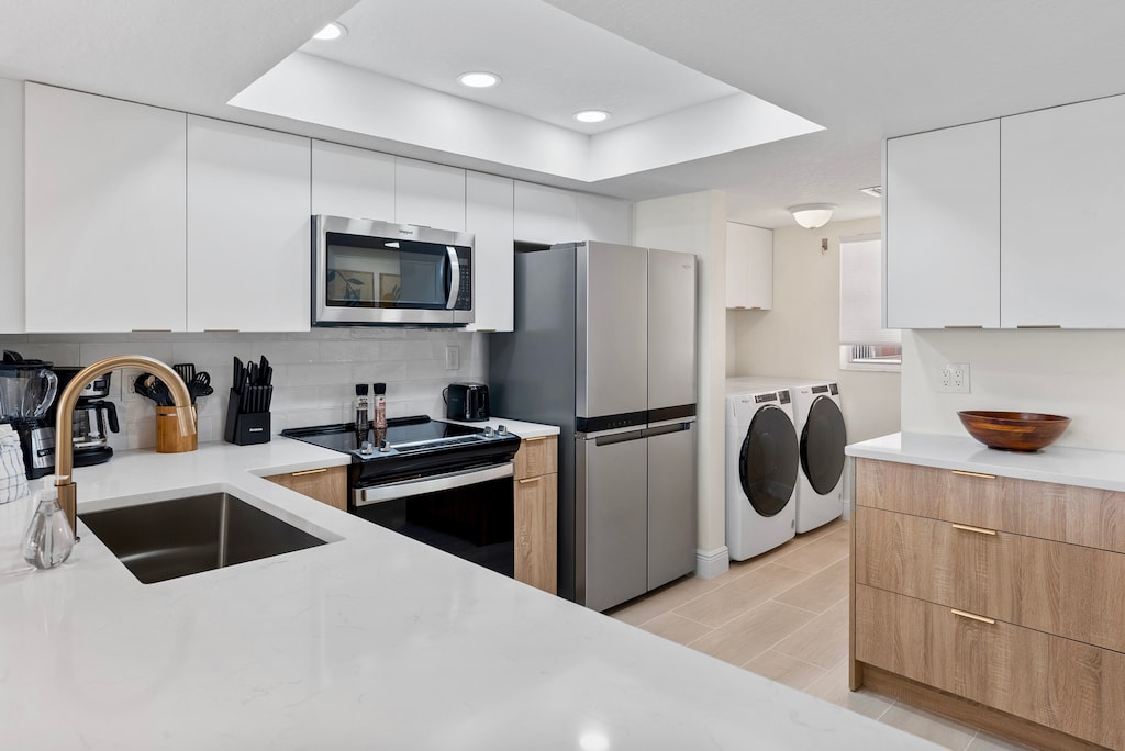 Brand new kitchen along with a washer & dryer in the unit