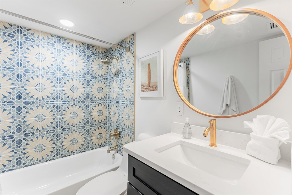 Modern bathroom featuring a spacious shower and tub combo.