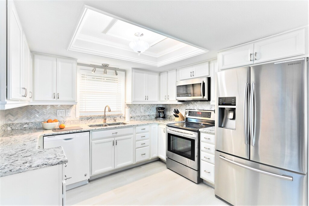 A chef's dream kitchen with stainless appliances, granite counters, and charm.