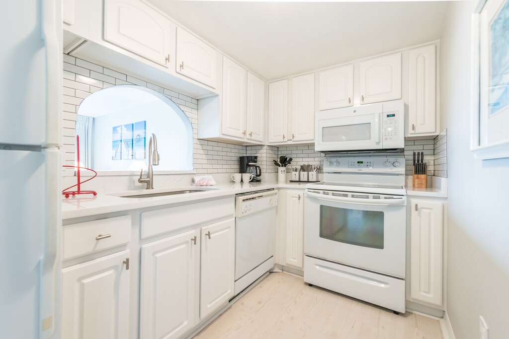 Bright and modern kitchen with an open layout leading to the dining area.