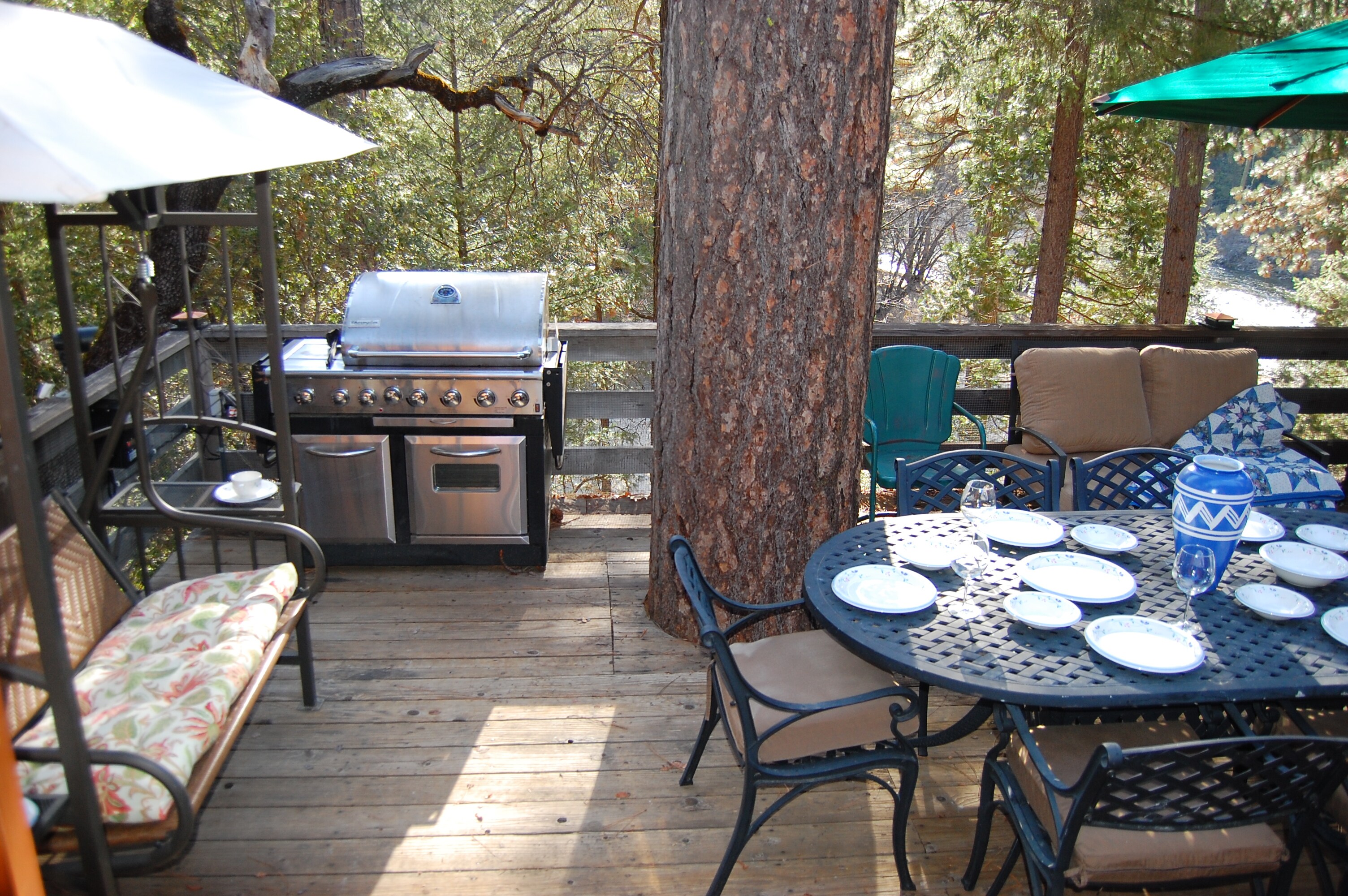 Covered swing, large gas grill, picnic table for 6, and the south fork of the Merced River too!