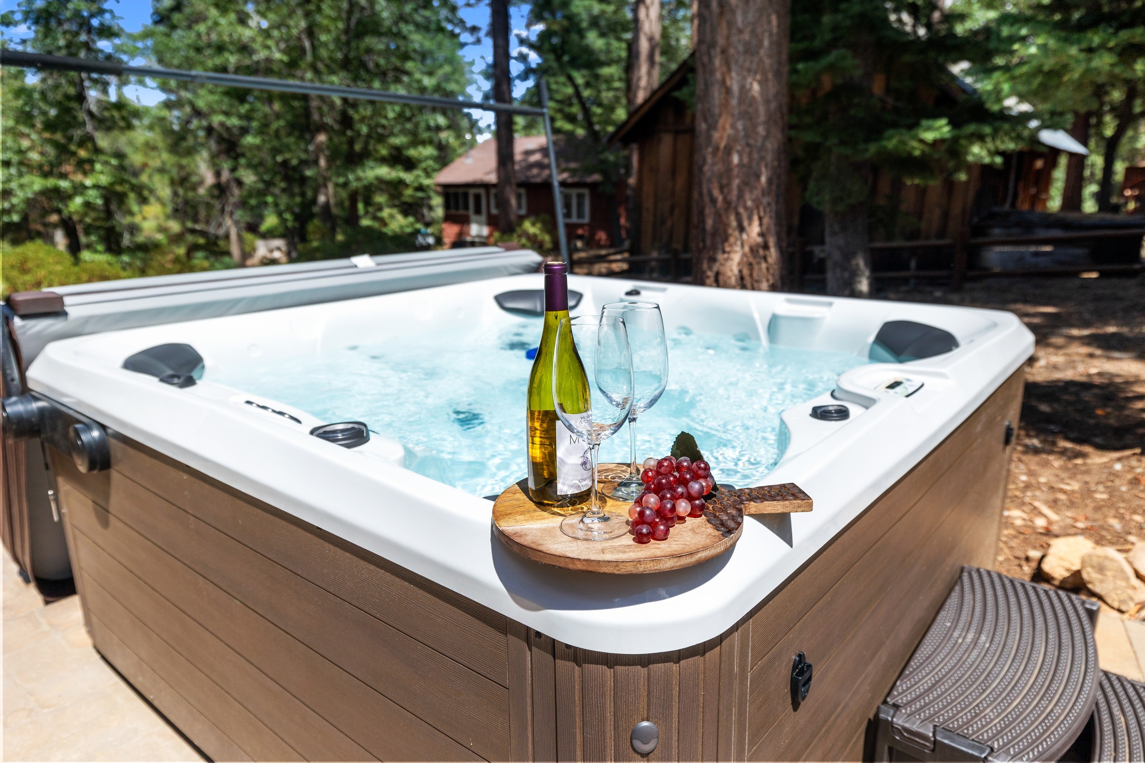Luxurious hot tub in the backyard is perfect for a soak after a day of exploring.