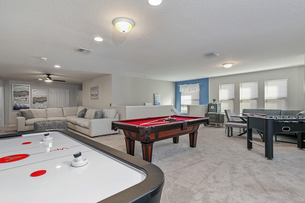 Fun play and lounge area including pool and foosball tables