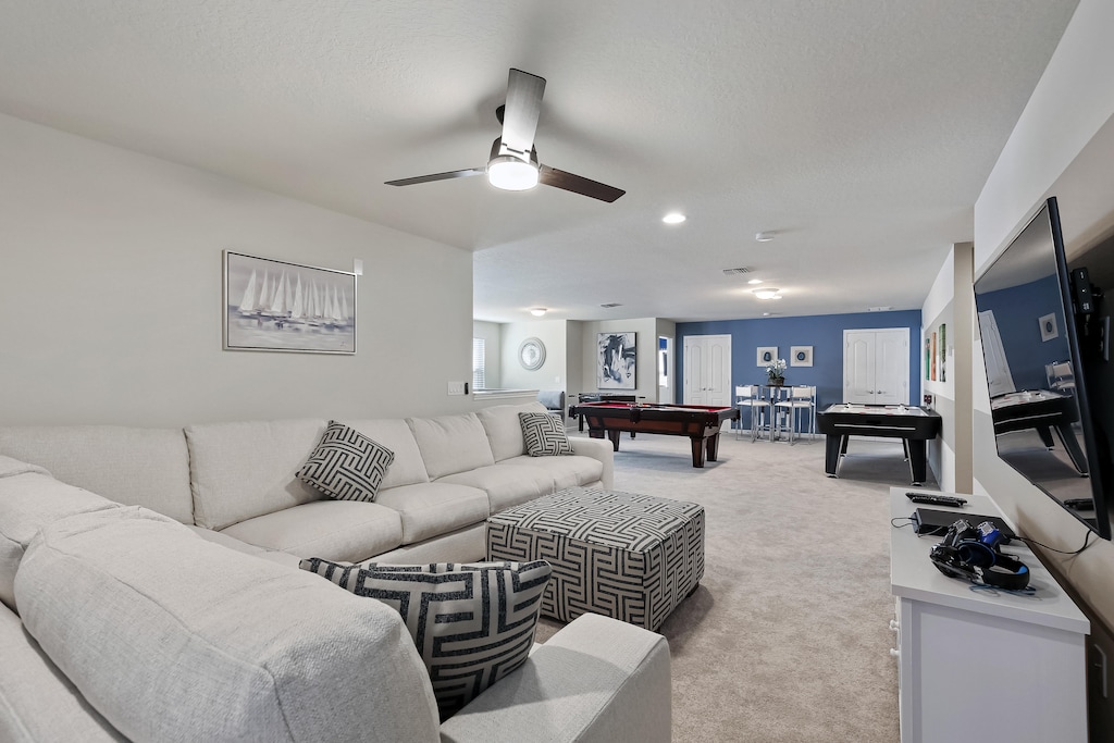 View 3 of the grand movie room adjacent to the play area