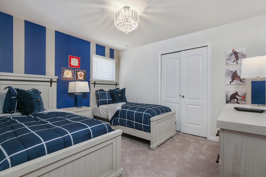 Sports themed 2 twin bed with flat screen TV