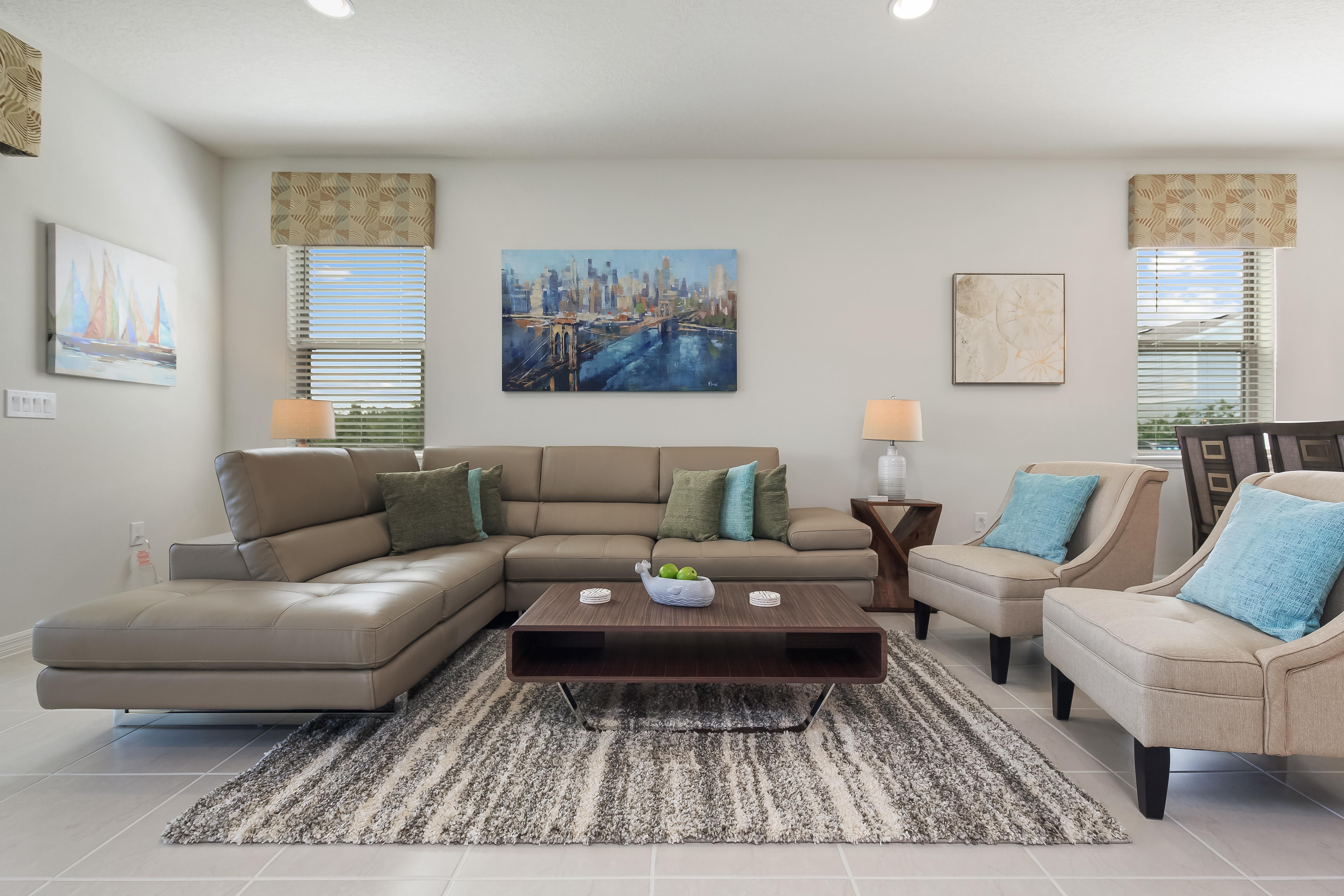Spacious living room with comfortable furniture and flat screen TV
